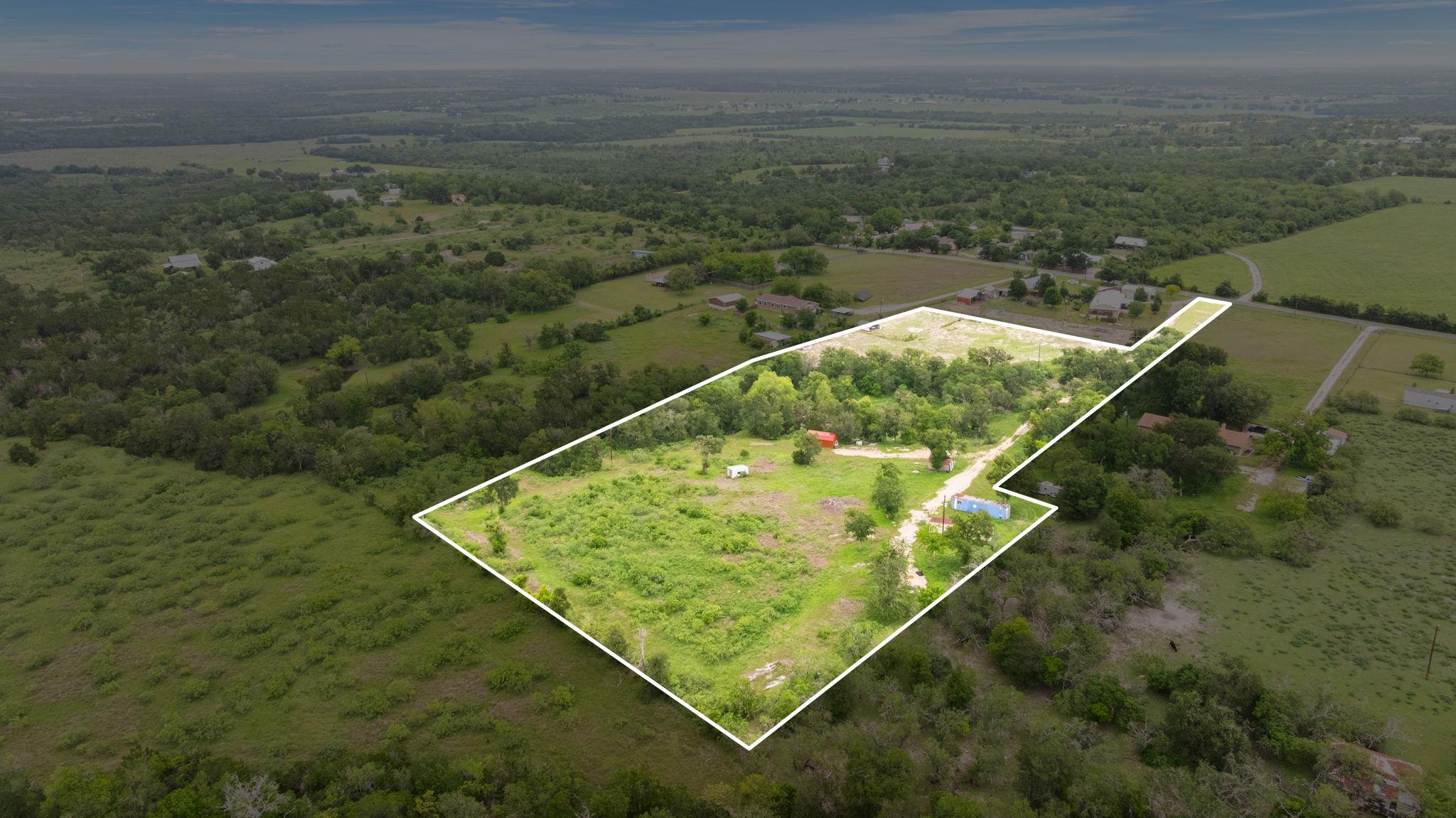 Expansive land parcel featuring a mix of open cle