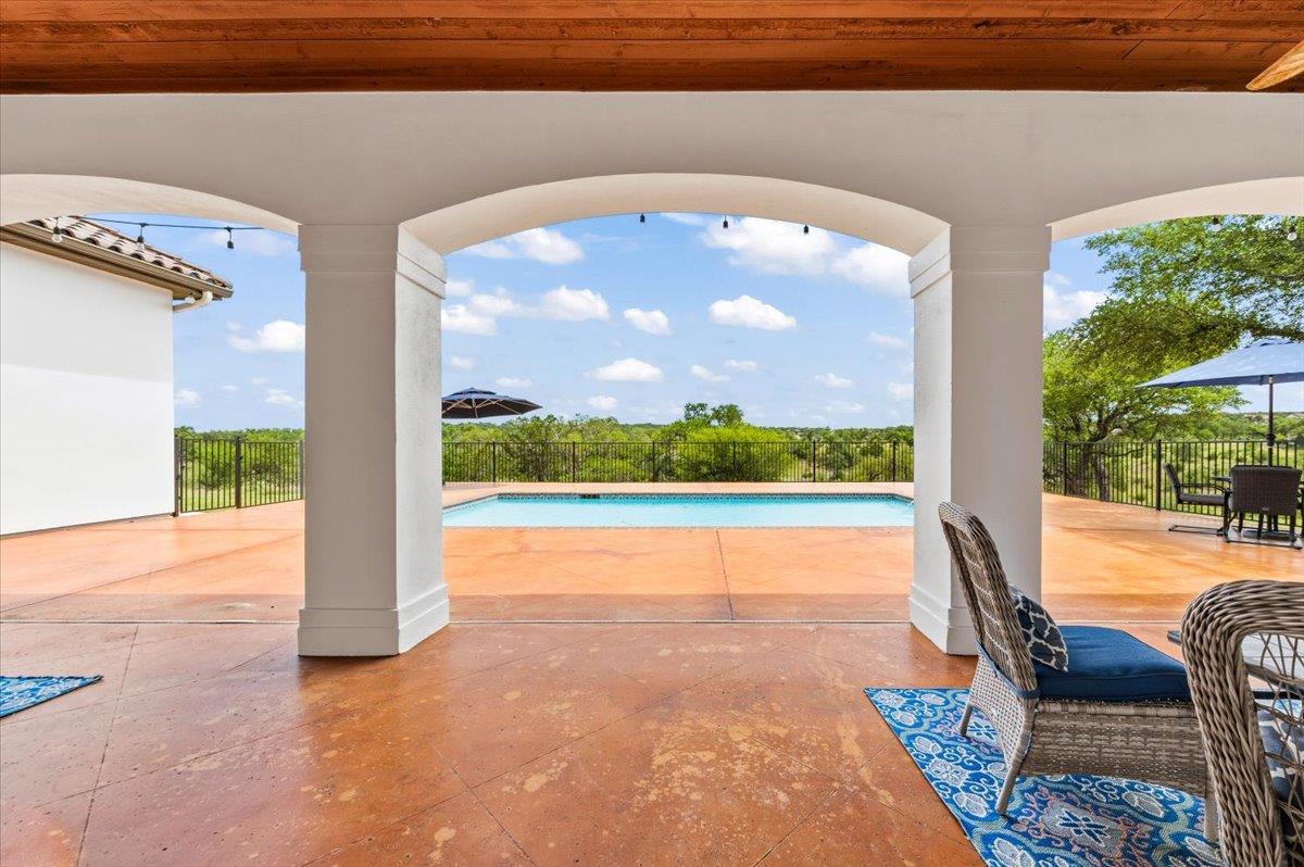 Arched patio with stained concrete flooring, expo