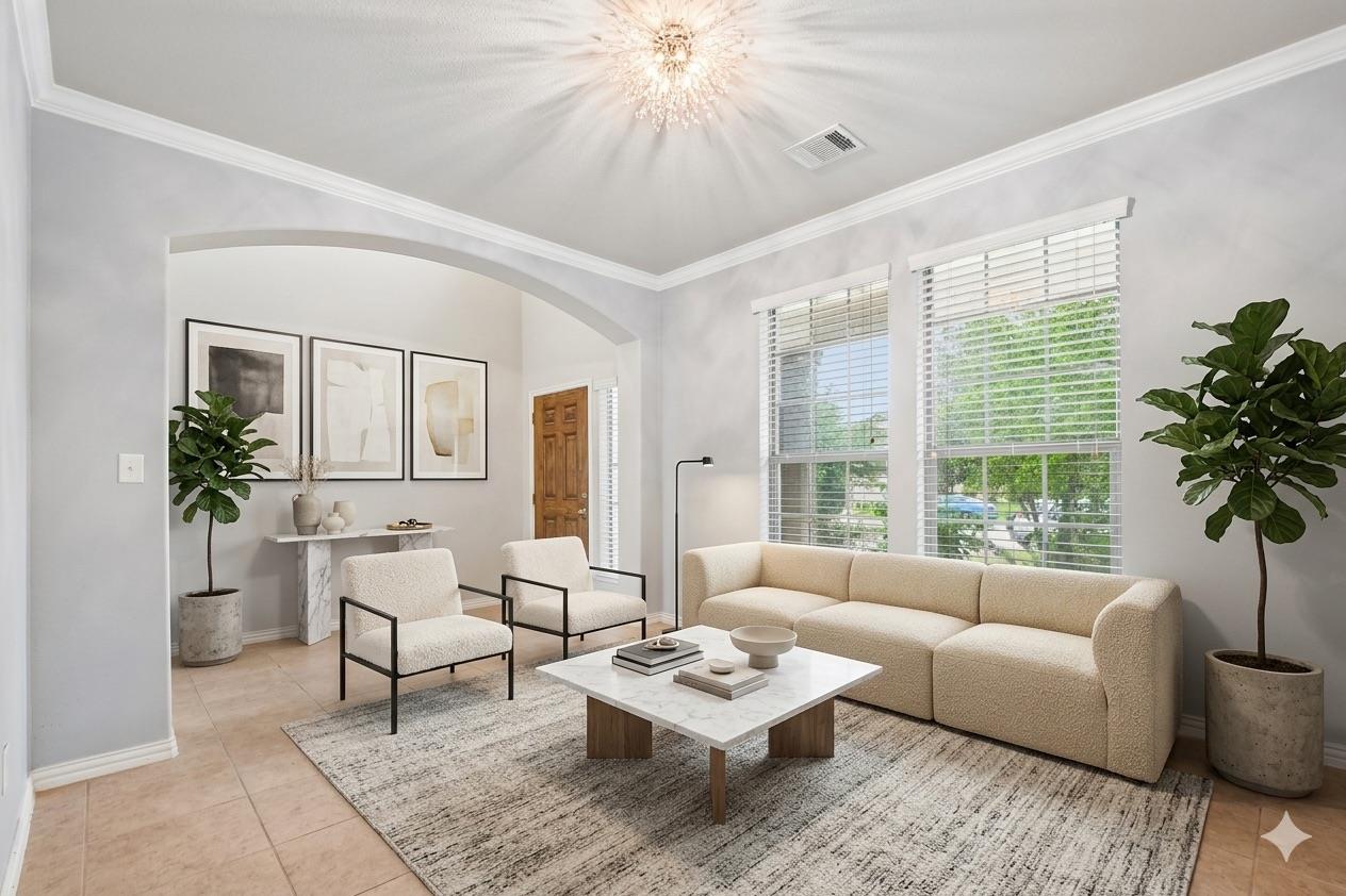 Spacious living area featuring light-toned tile f
