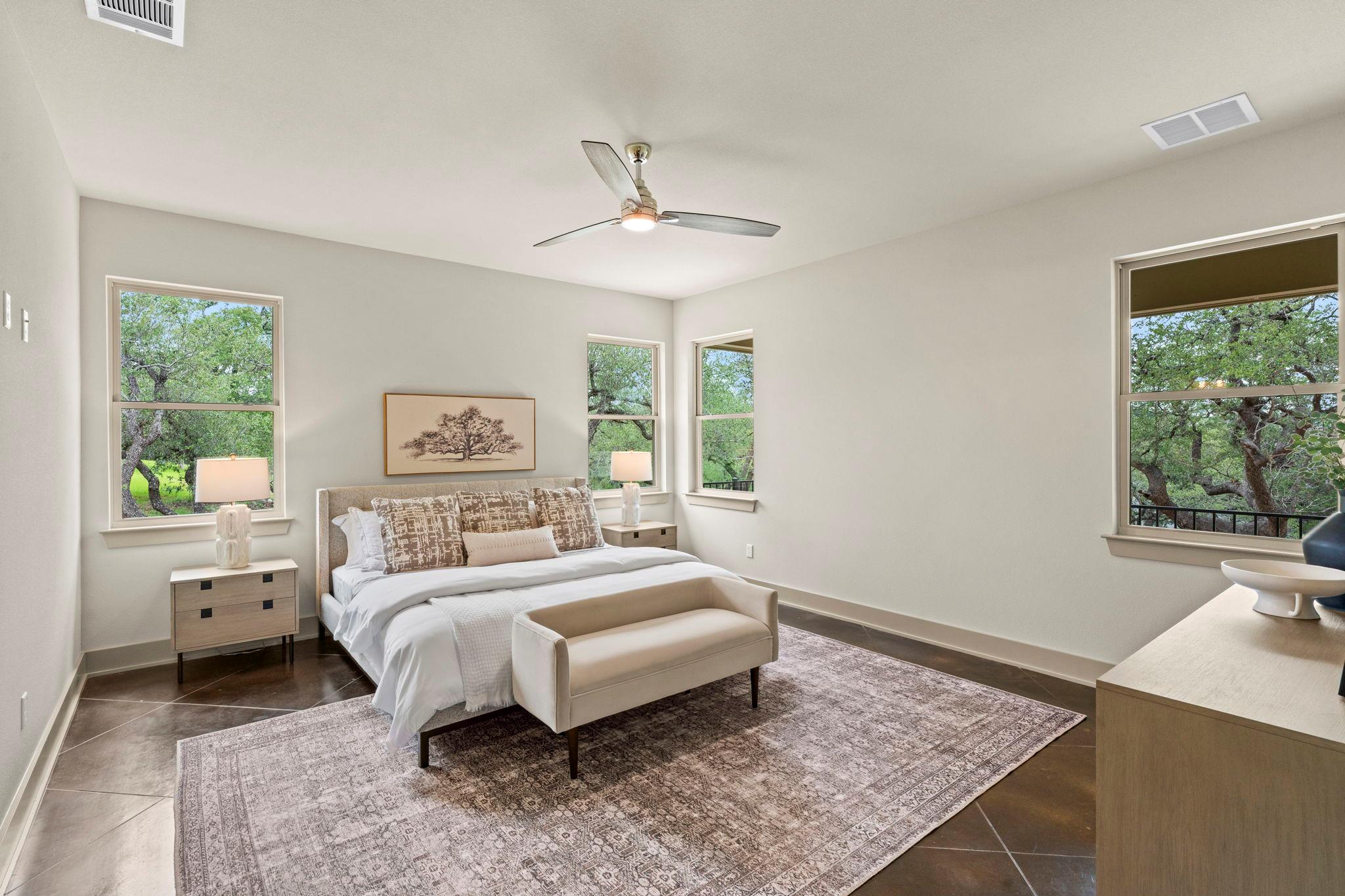 Spacious bedroom featuring dark-toned tile floori