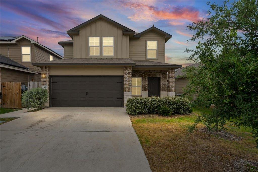 Two-story residential architecture featuring a bl