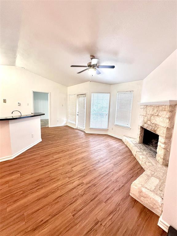 Spacious living area featuring wood-finish floori