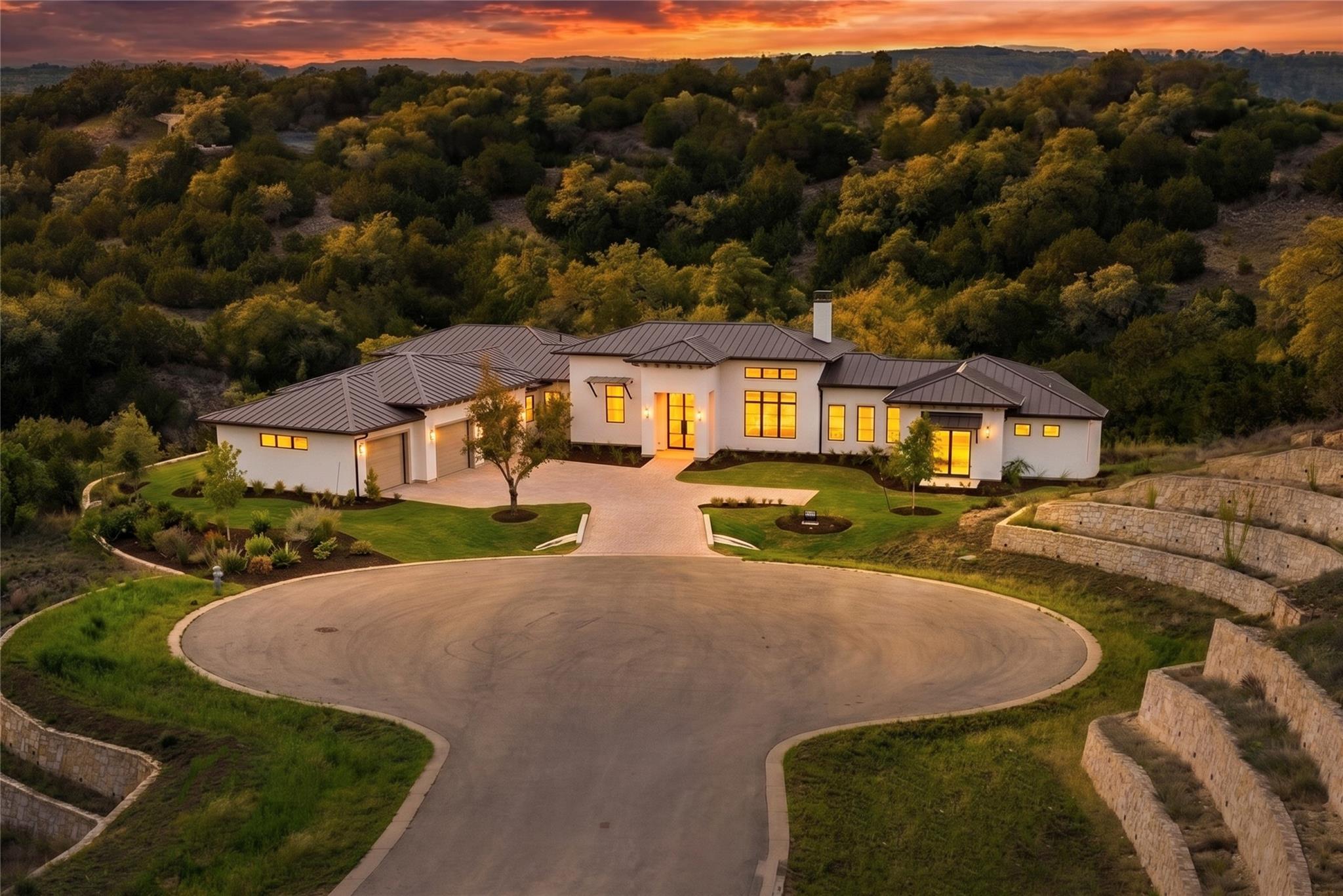 Spacious modern exterior with a metal roof and li