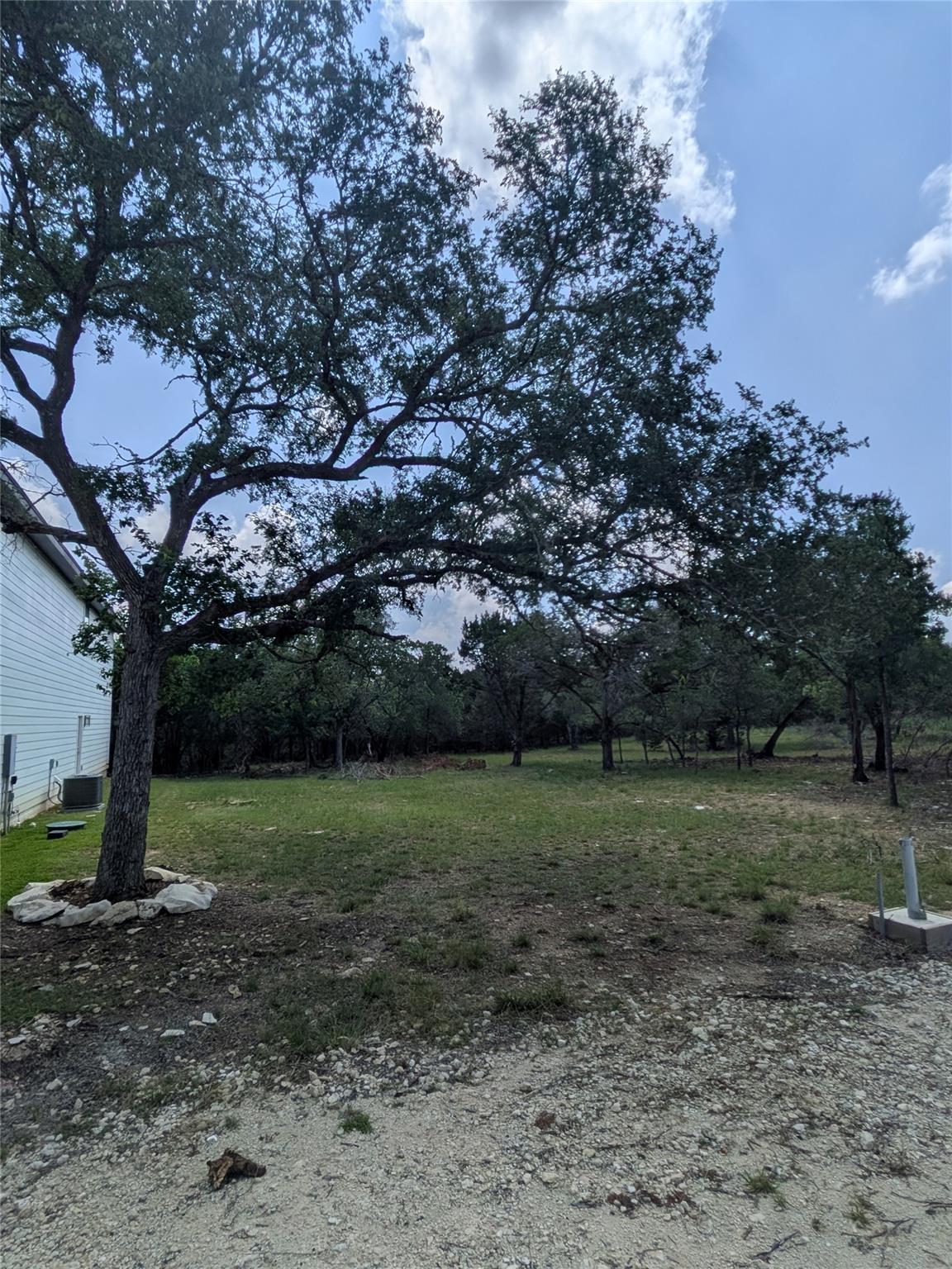 Mature trees shade a generous lot offering ample 