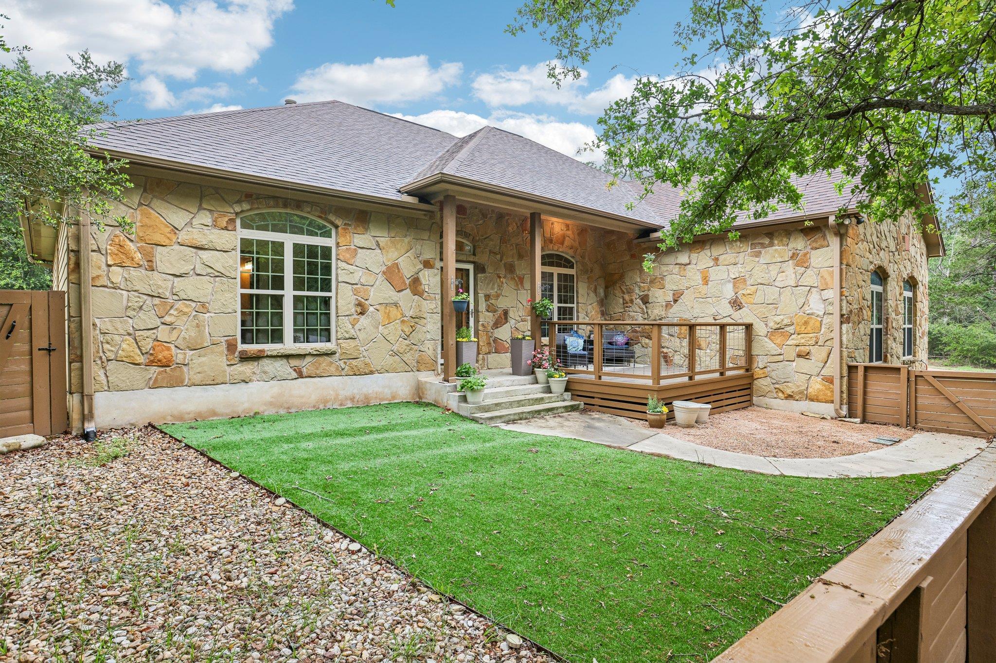 Exterior featuring natural stone masonry, a cover