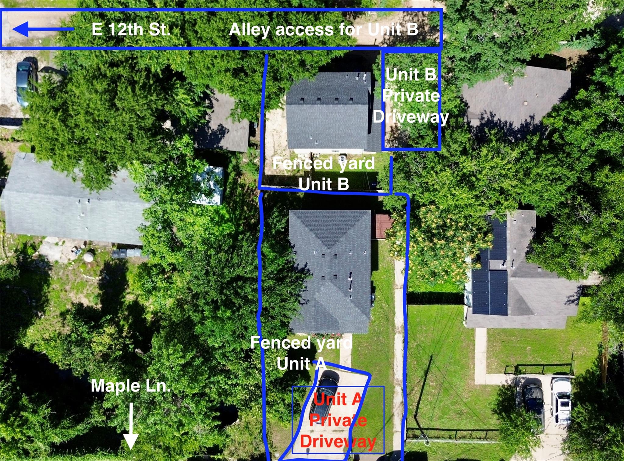 An aerial perspective showcases dual fenced yards