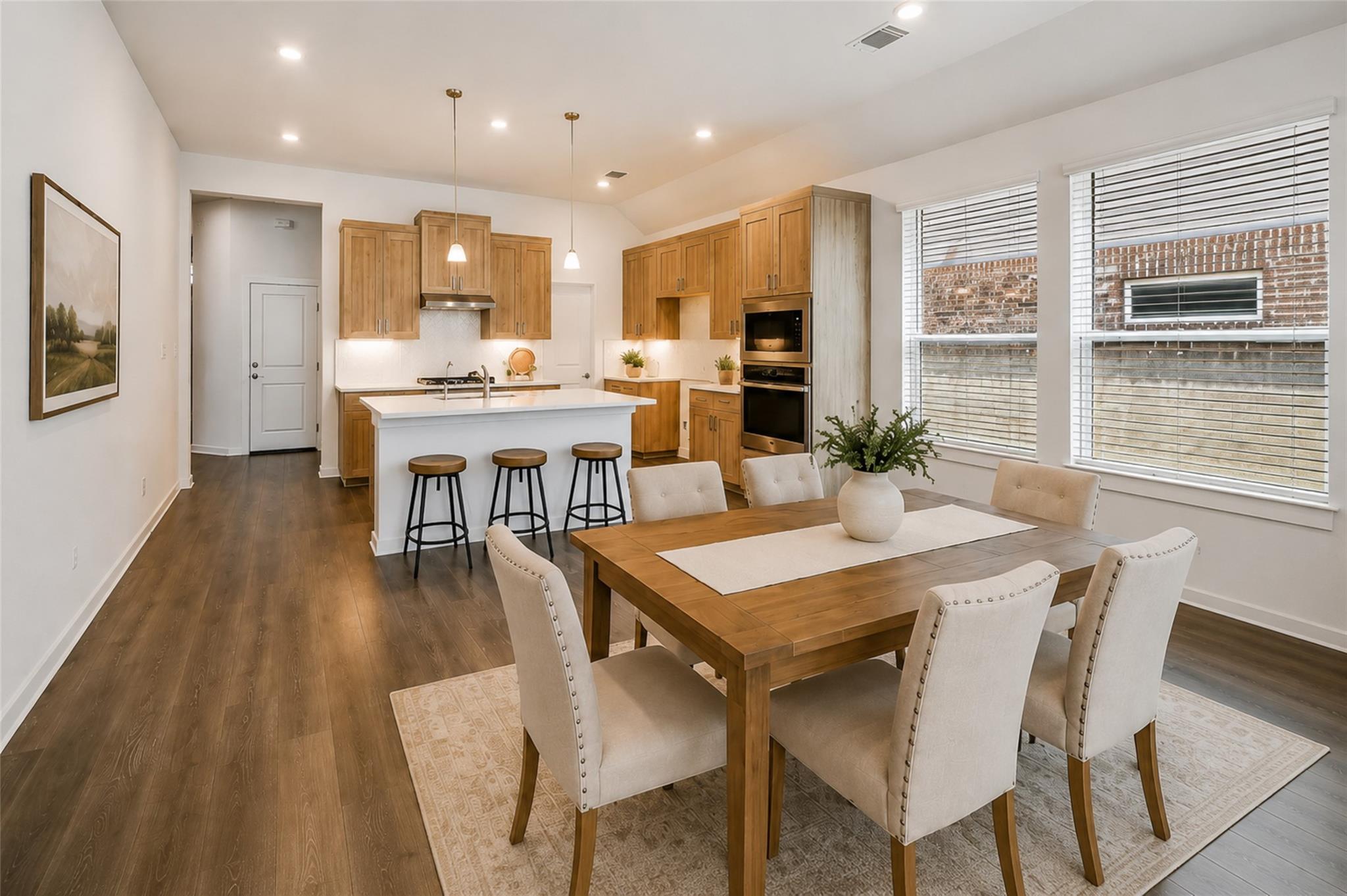 An open-concept design seamlessly connects the cu