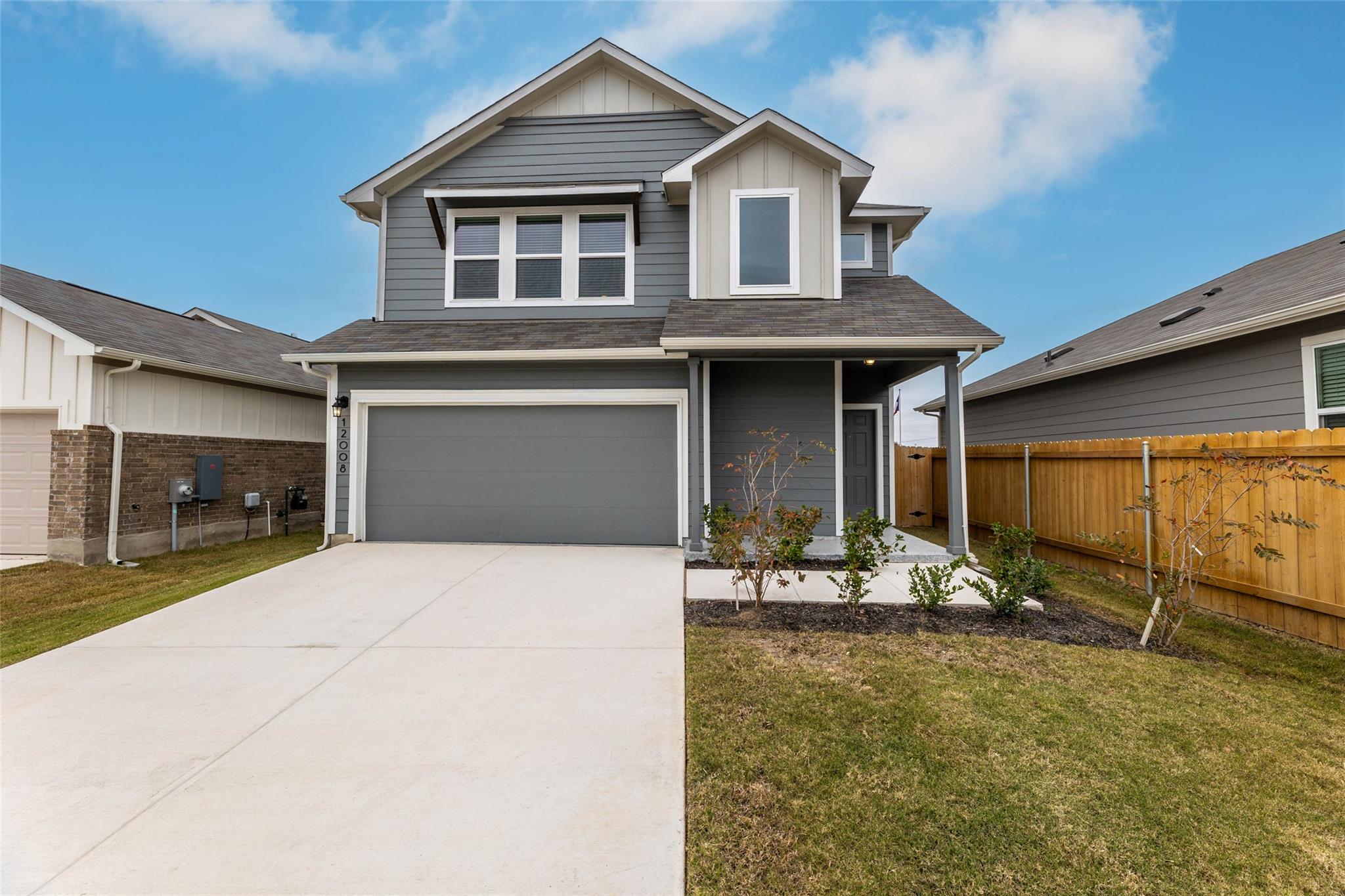 A contemporary exterior showcasing a driveway, a 