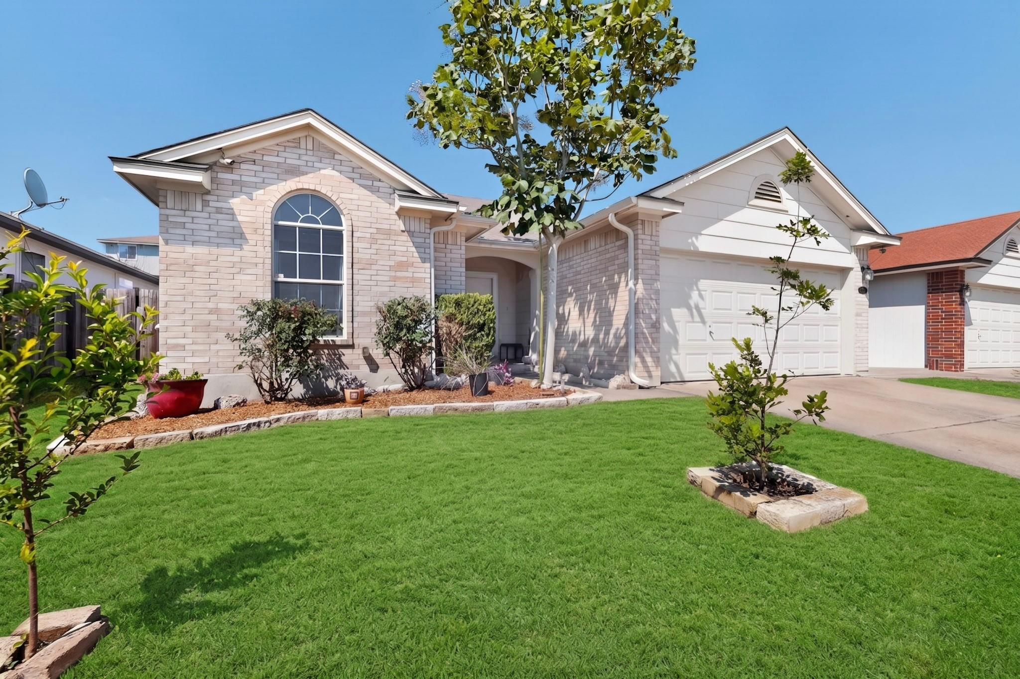Single-story residence featuring light-colored br