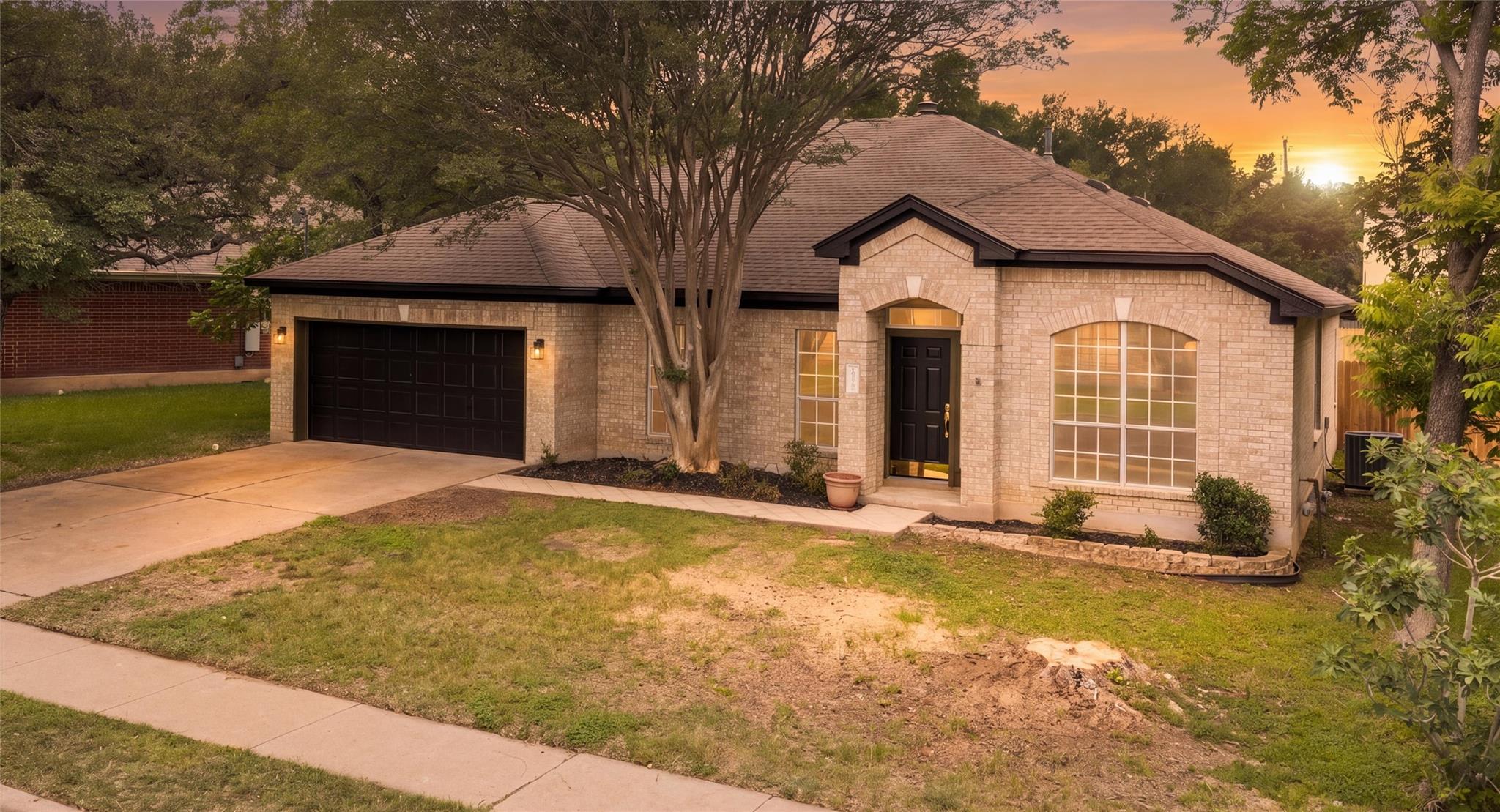 Light-colored brick exterior featuring a dark arc