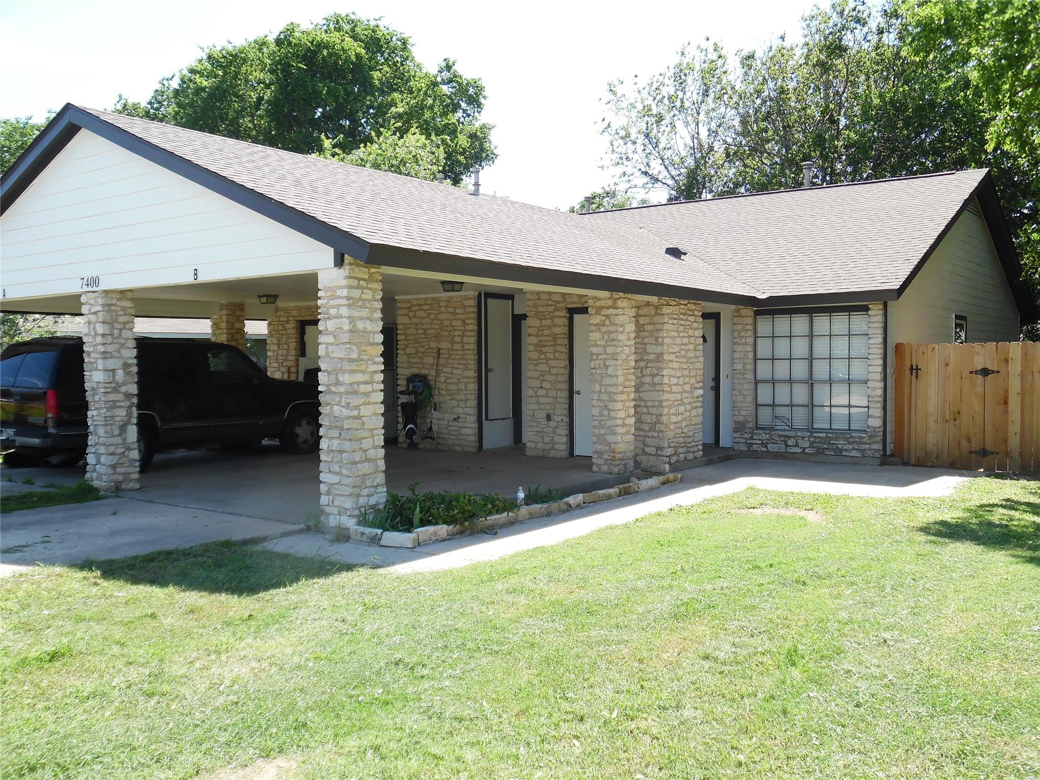 Exterior facade featuring stone veneer columns an
