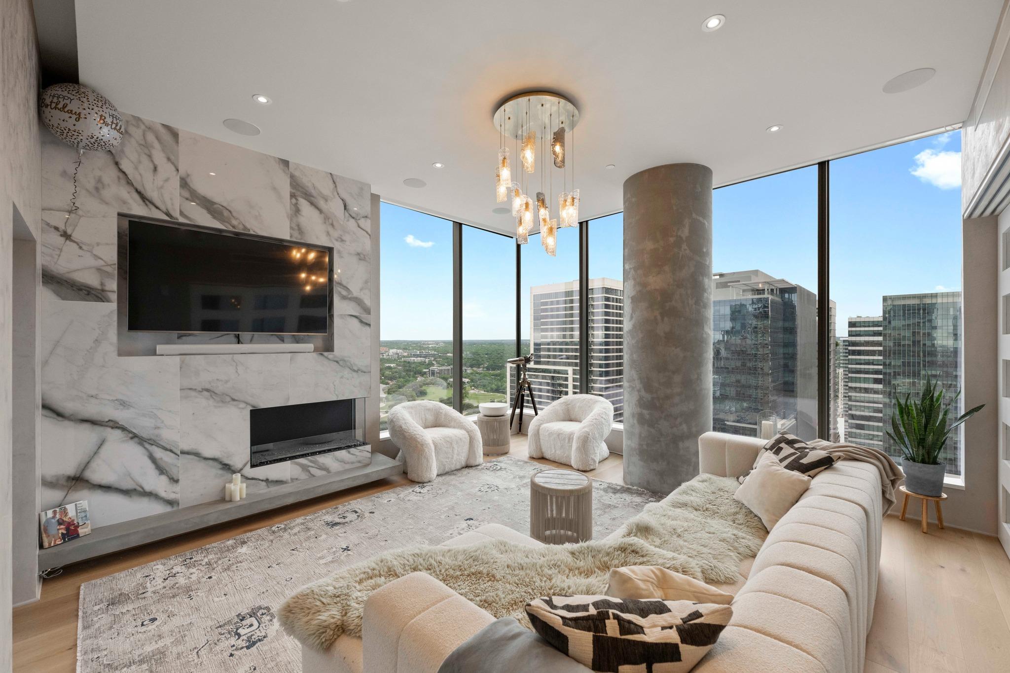 Floor-to-ceiling windows highlight the urban land