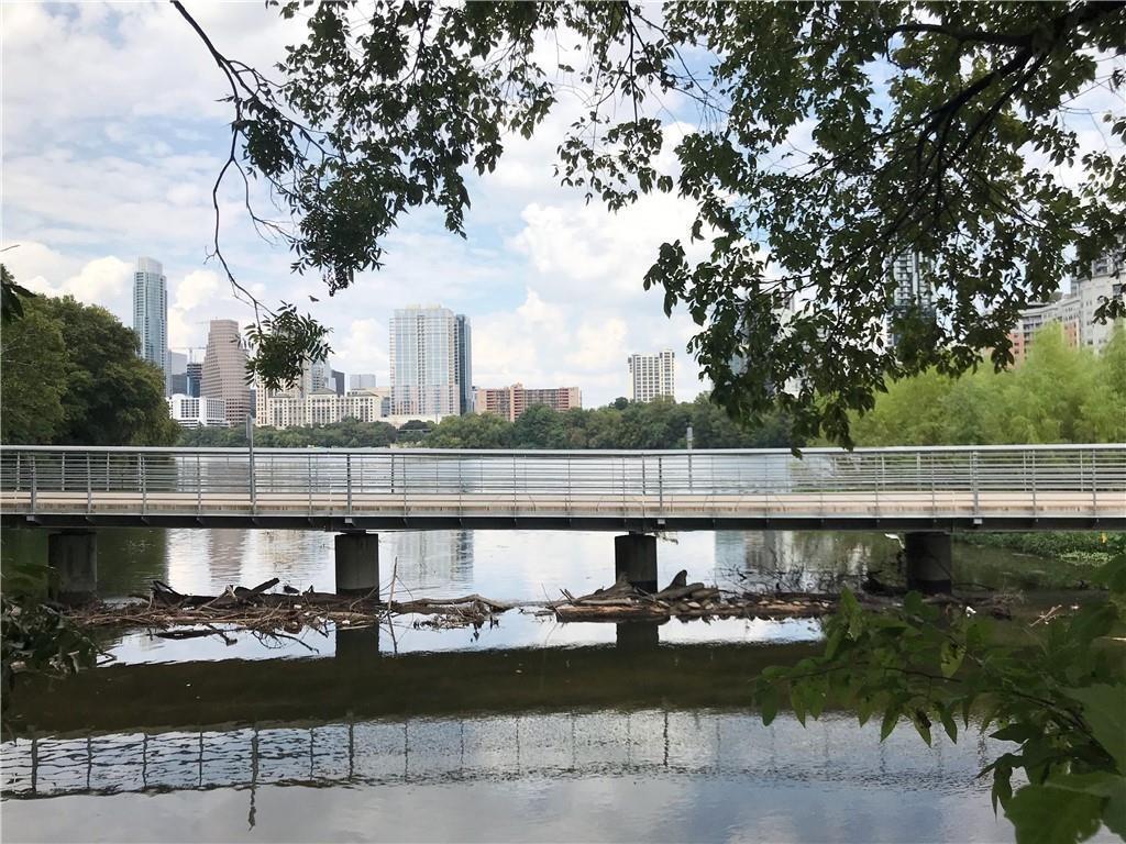 Waterfront setting featuring a pedestrian bridge 