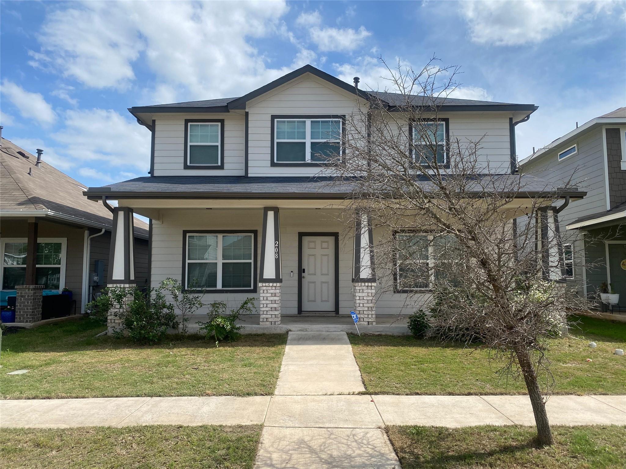 Two-story residence featuring light-colored sidin