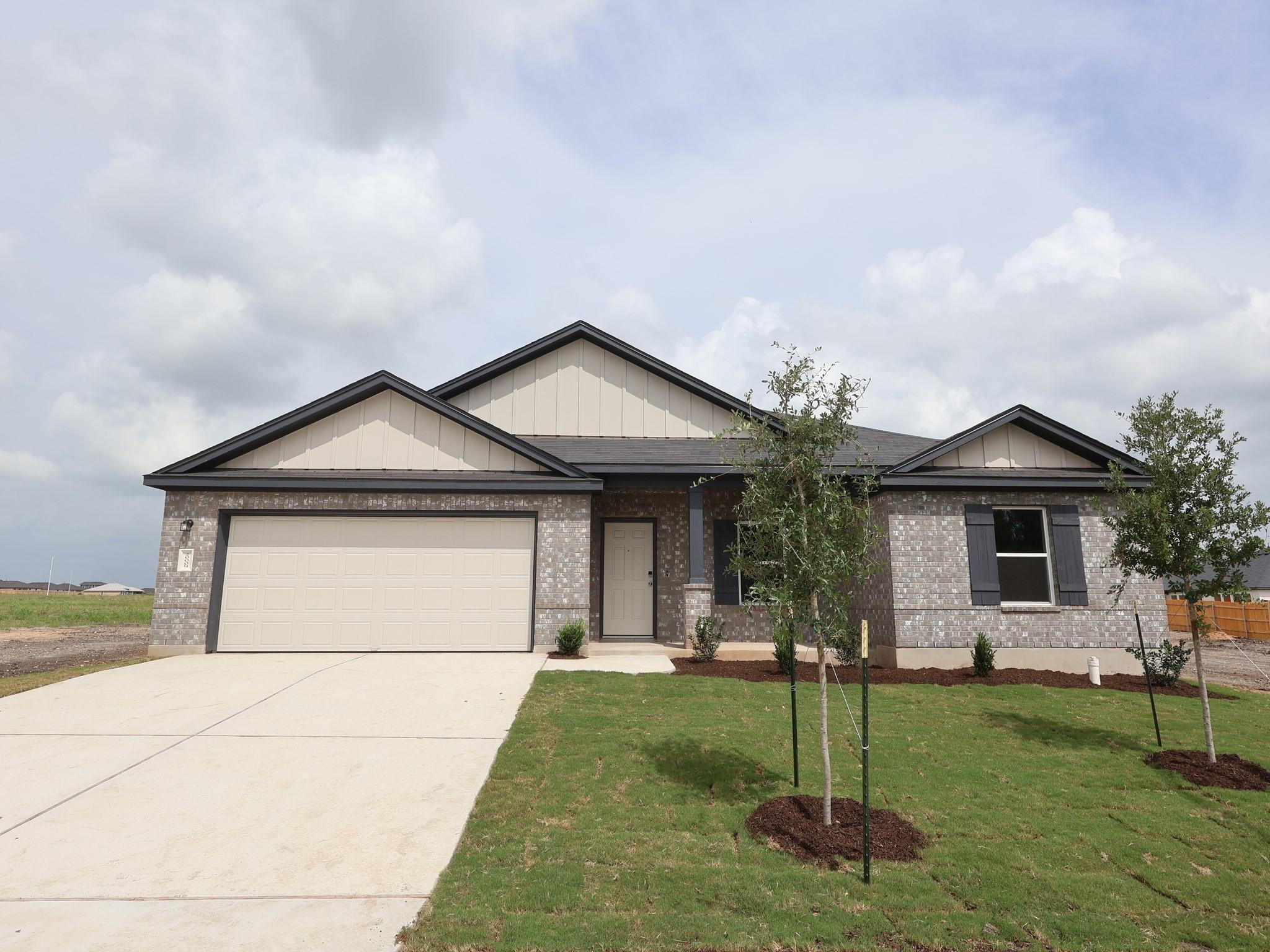 A well-maintained lawn and sturdy brick exterior 