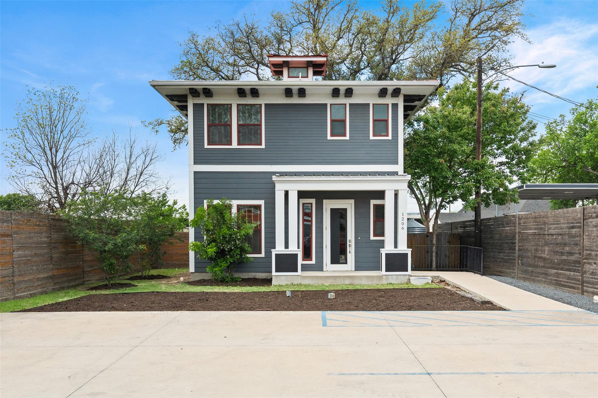 Contemporary two-story exterior featuring deep bl