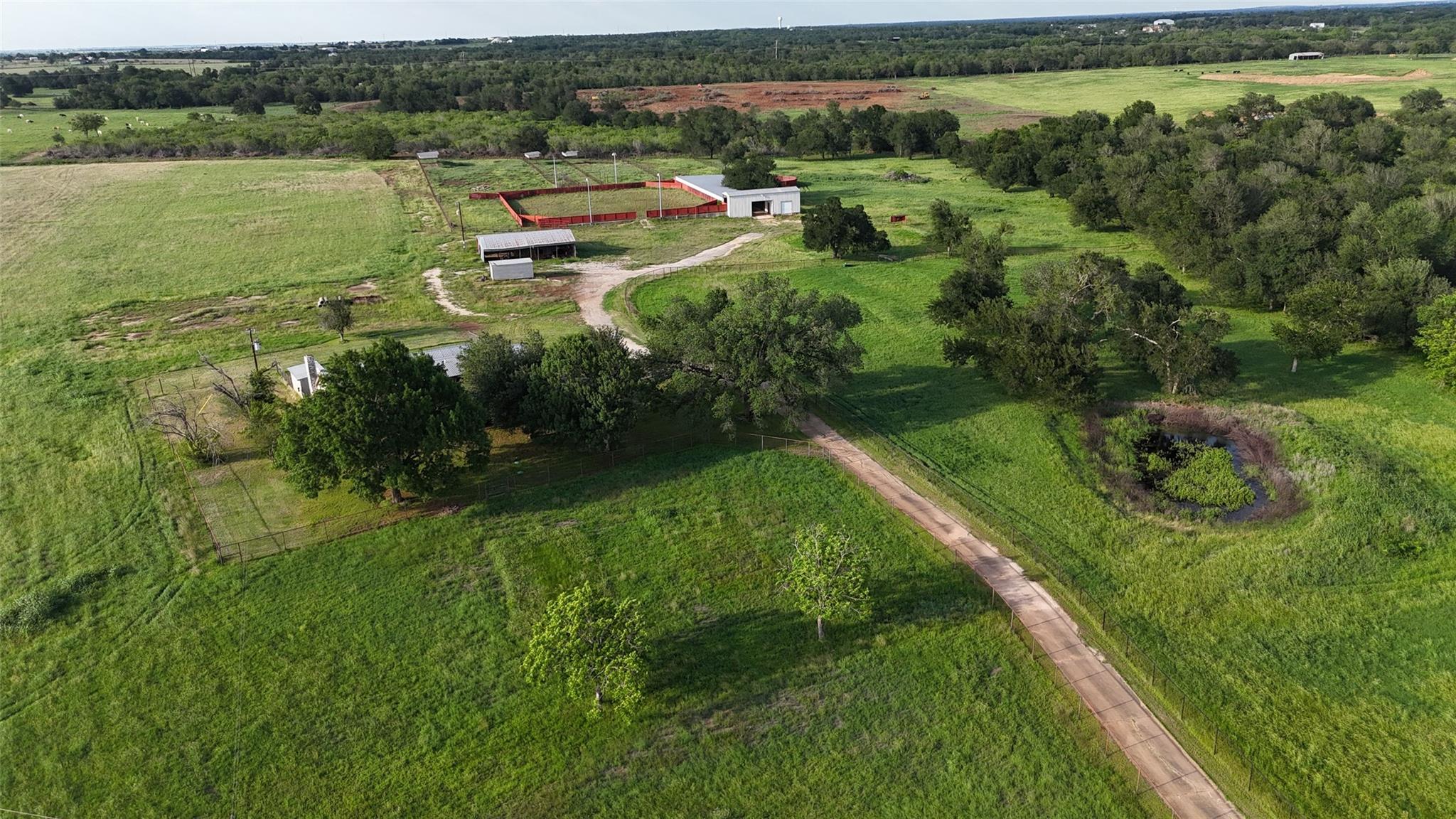 Sprawling acreage with a private pond and multipl