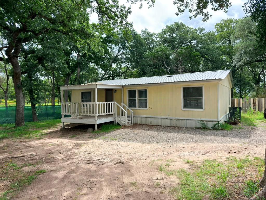 A quaint residence nestled amidst mature trees of