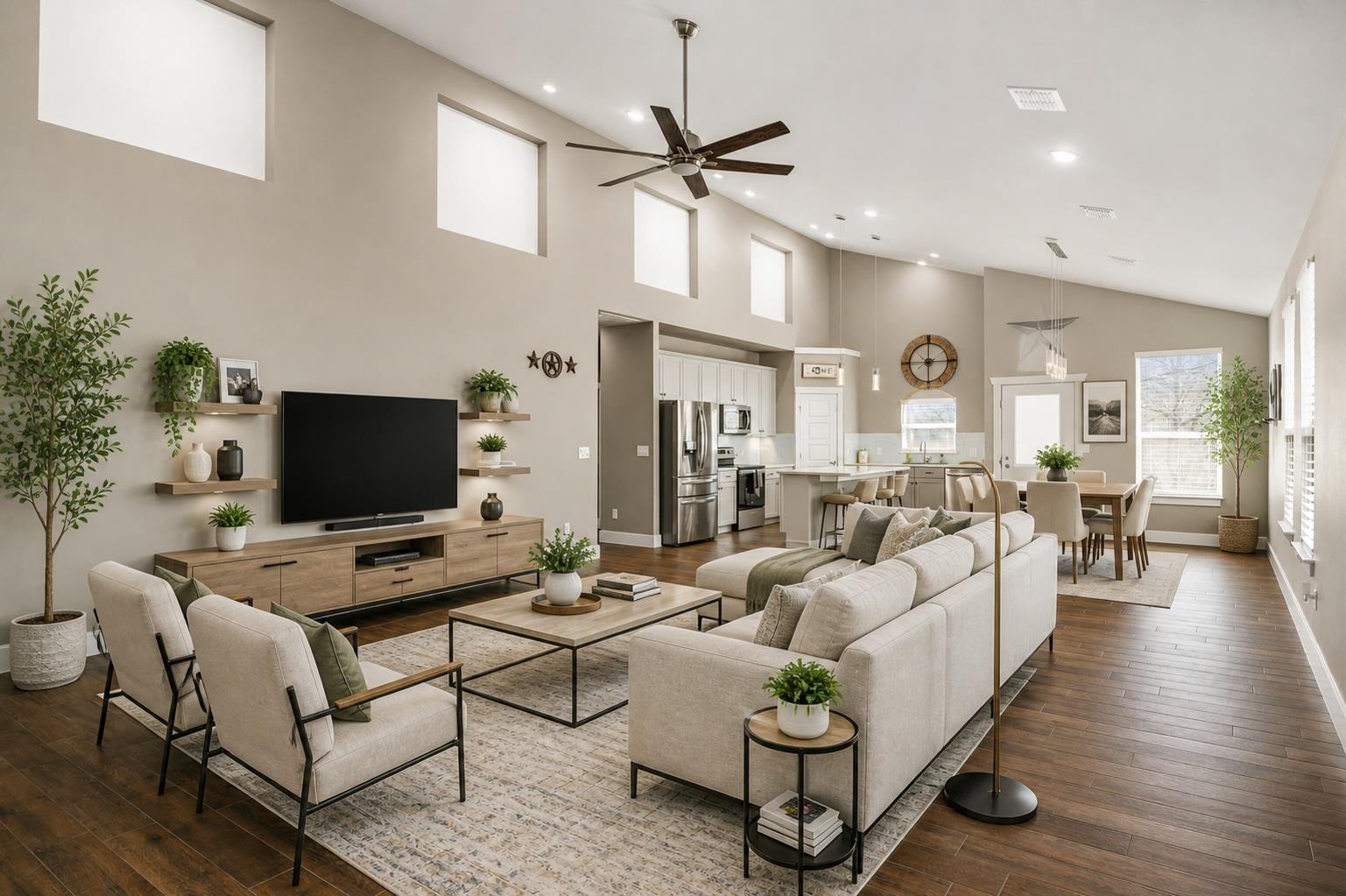Expansive living area featuring vaulted ceilings,