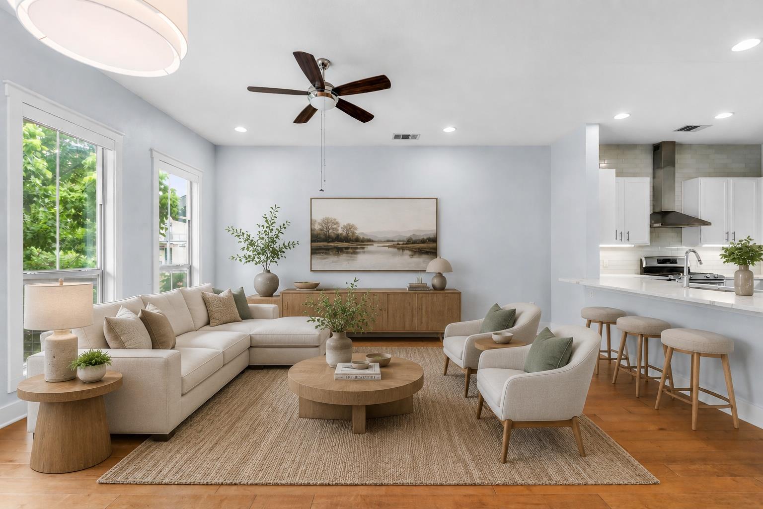 Open-concept living space featuring wood-finish f