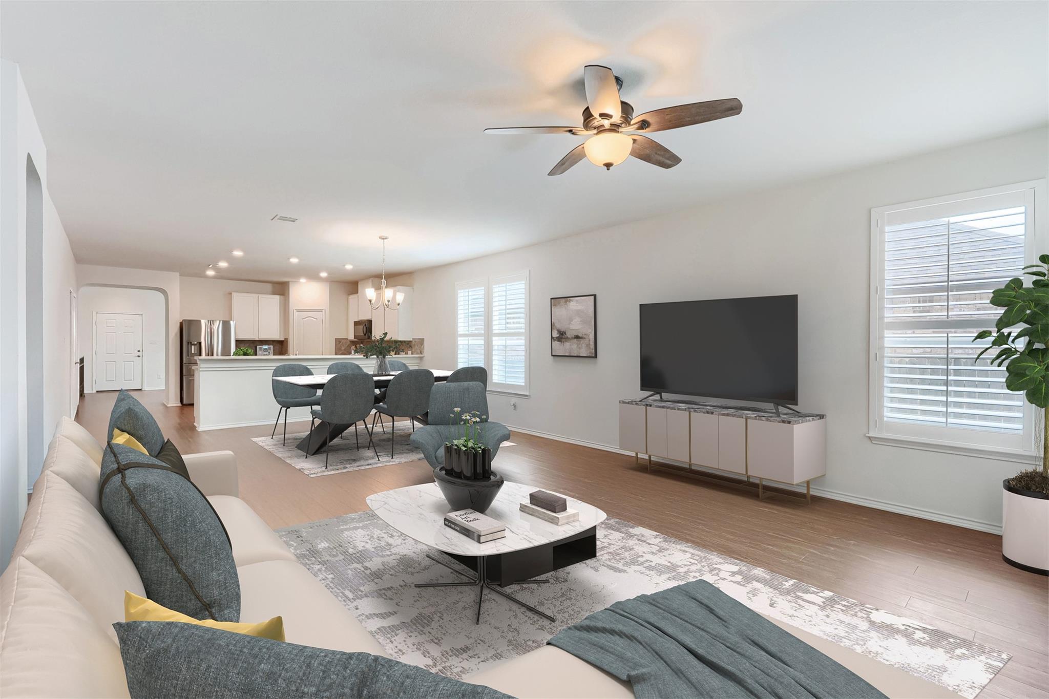 Spacious living area featuring wood-finish floori