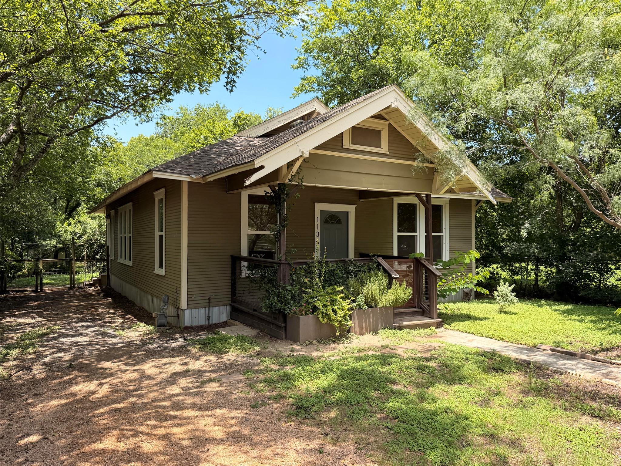 Discover a charming home nestled among lush trees