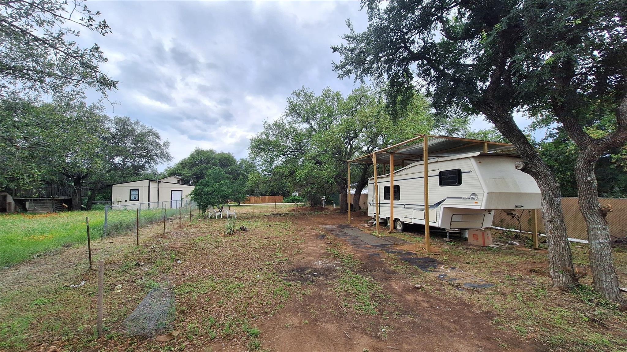 Expansive property featuring a tan detached struc