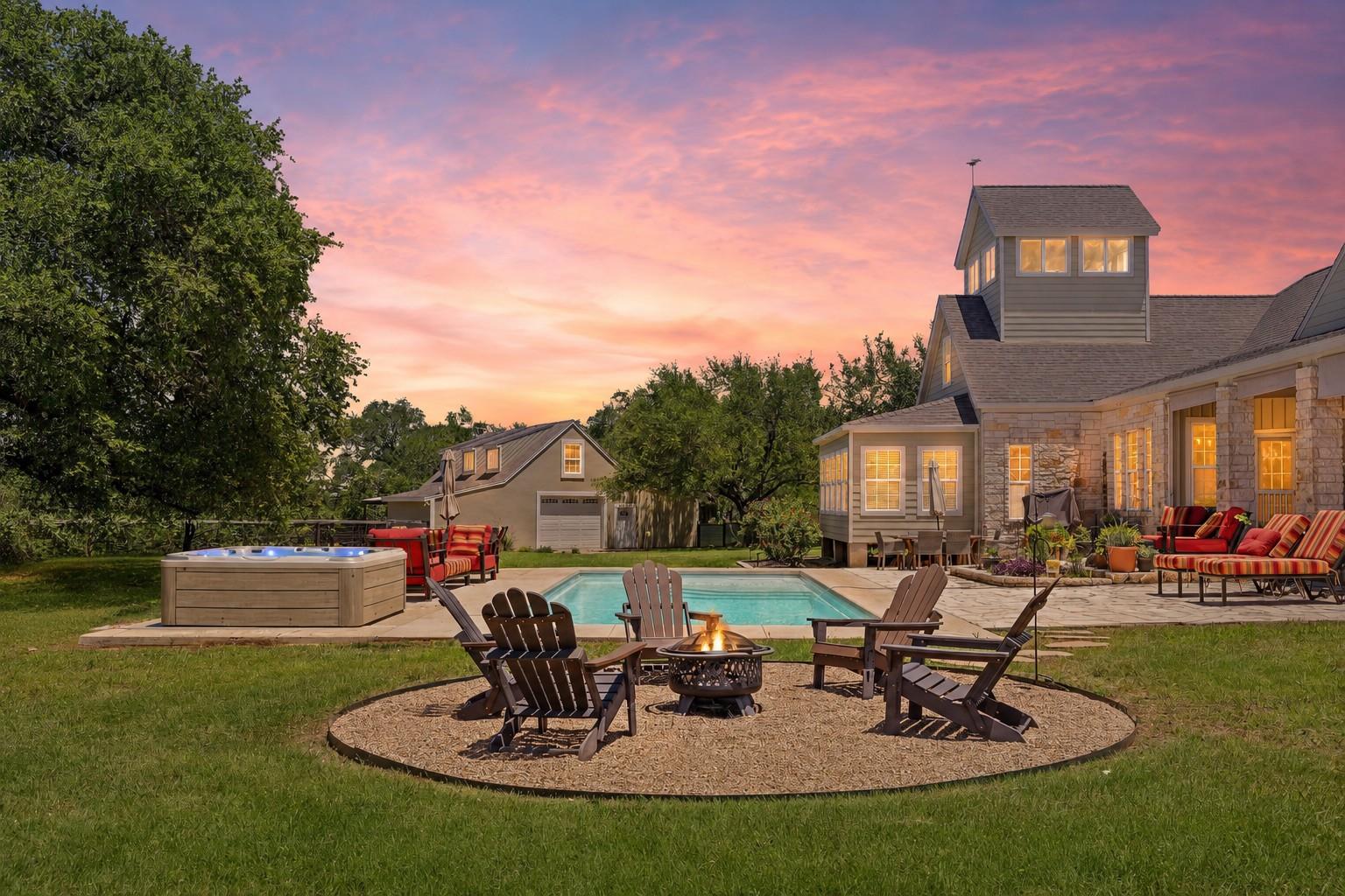 An inviting backyard oasis features a shimmering 