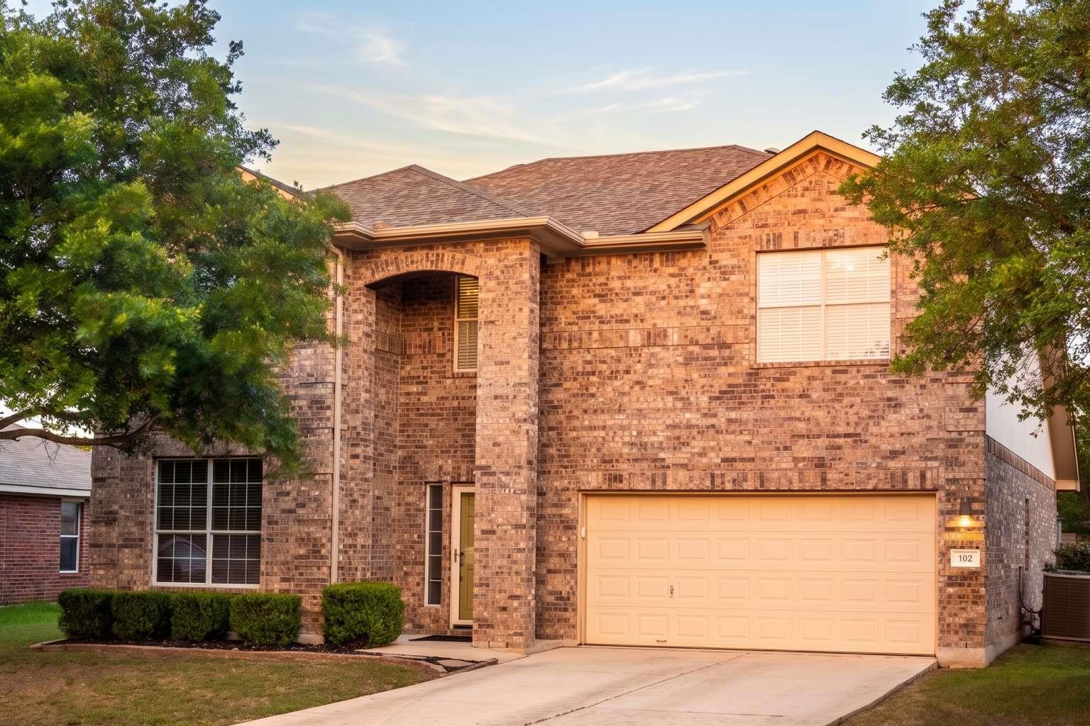 Brick exterior with an arched entry, prominent fr