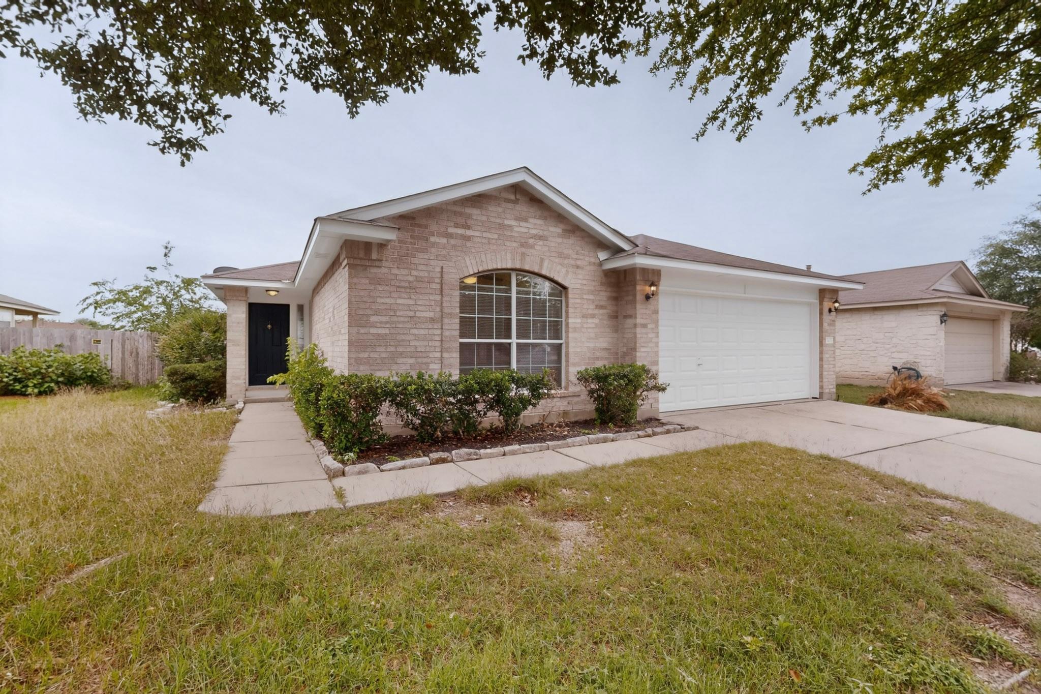 Brick-veneer exterior with a prominent arched win