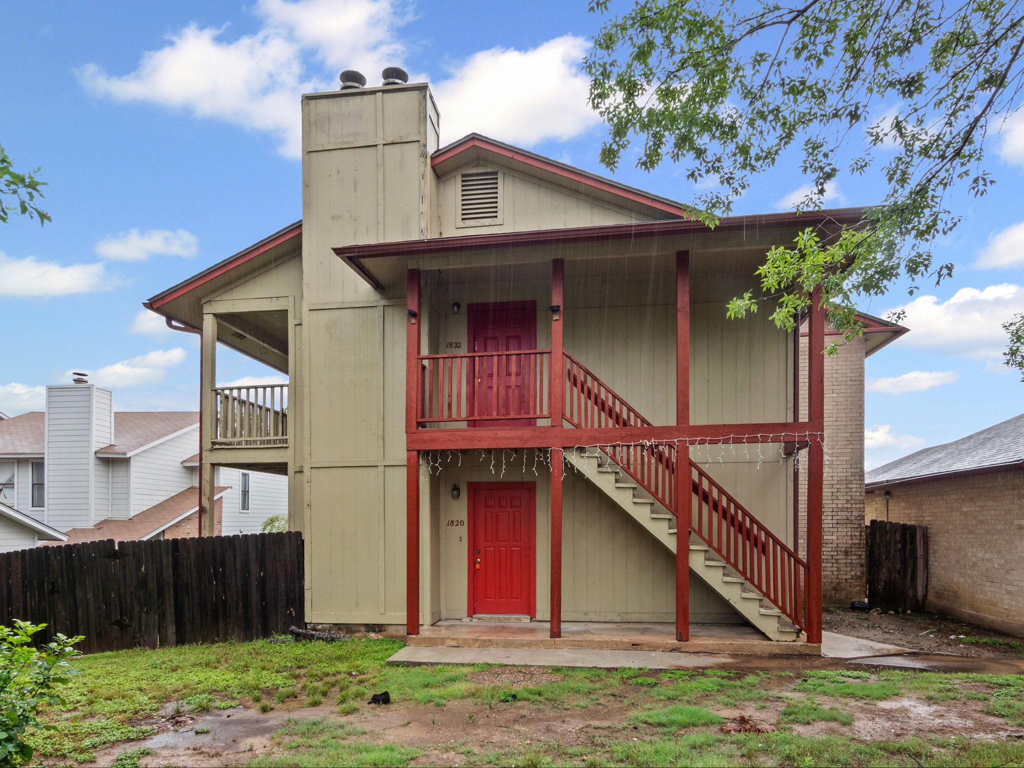 Back of house featuring stairway