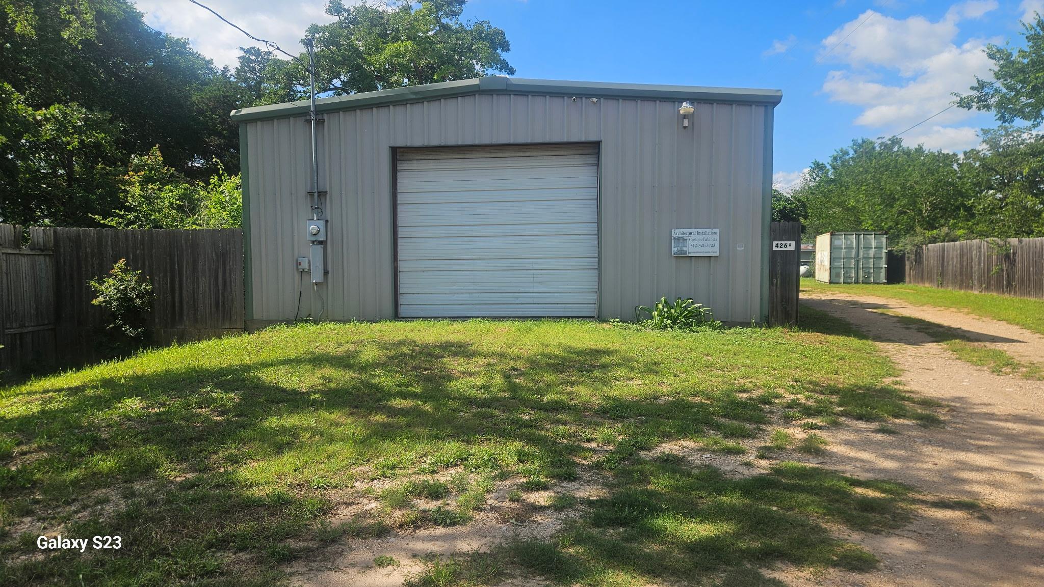Metal industrial building featuring a large roll-
