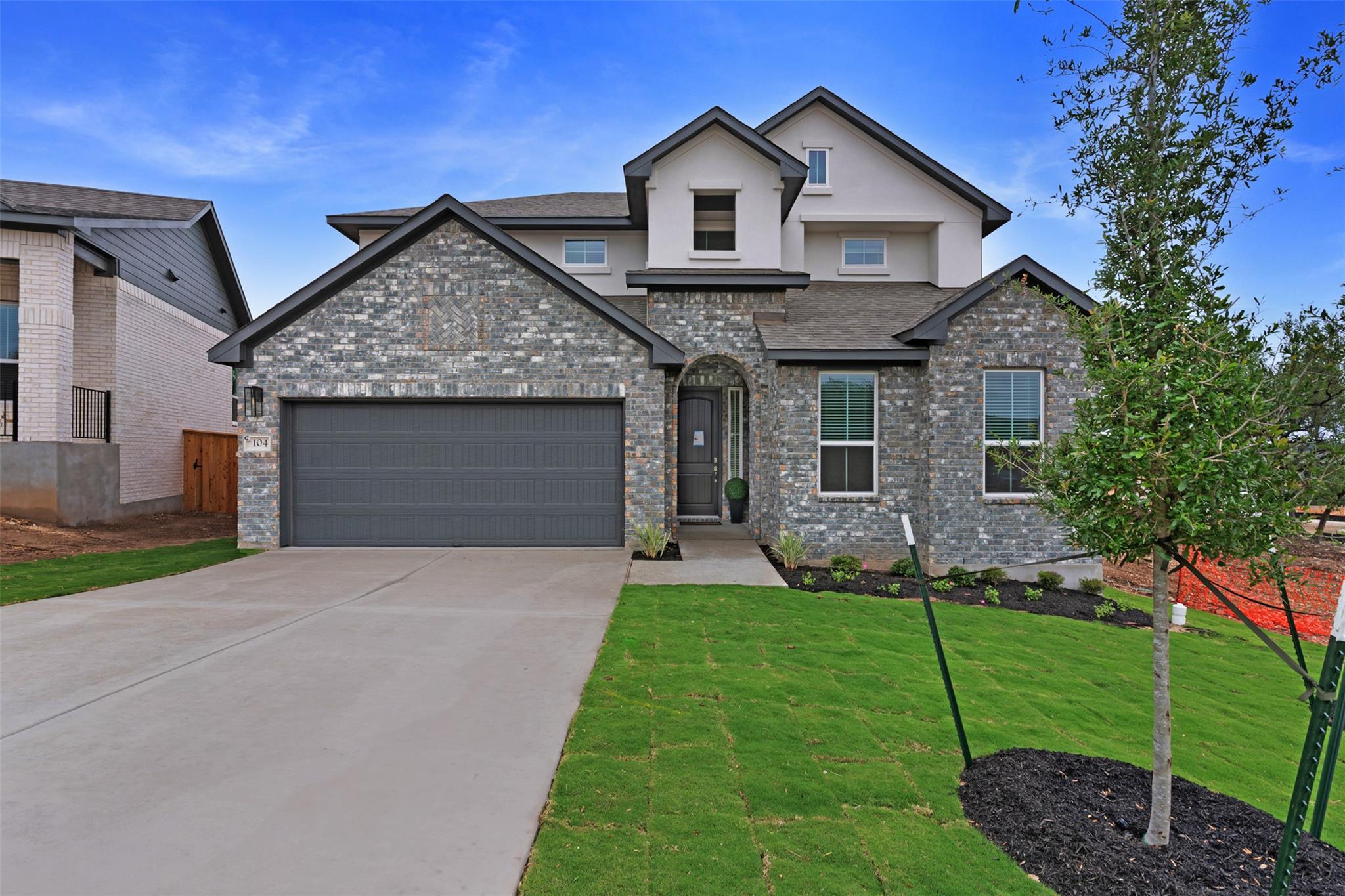 Contemporary two-story residence featuring a gray