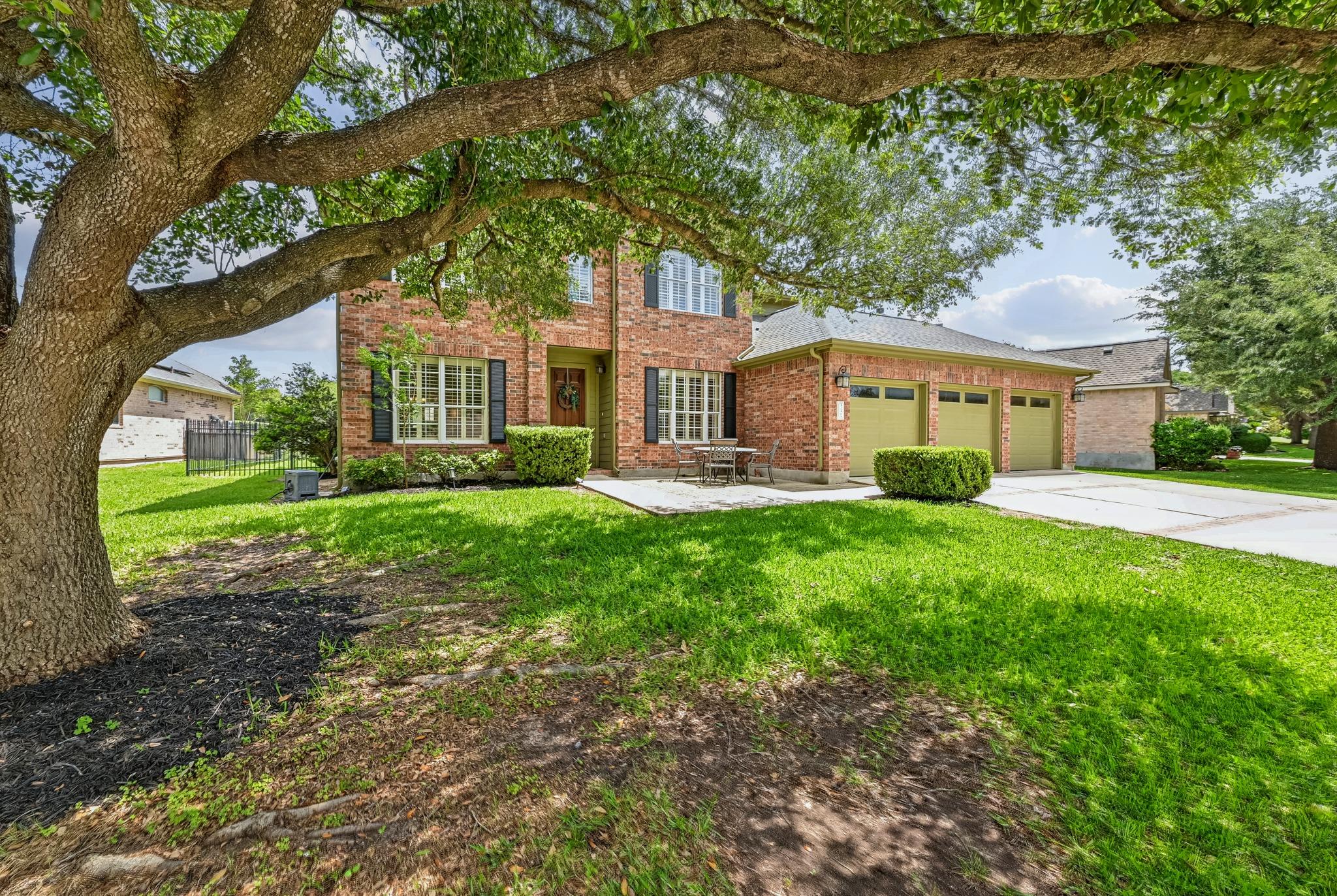Brick two-story residence with a three-car garage