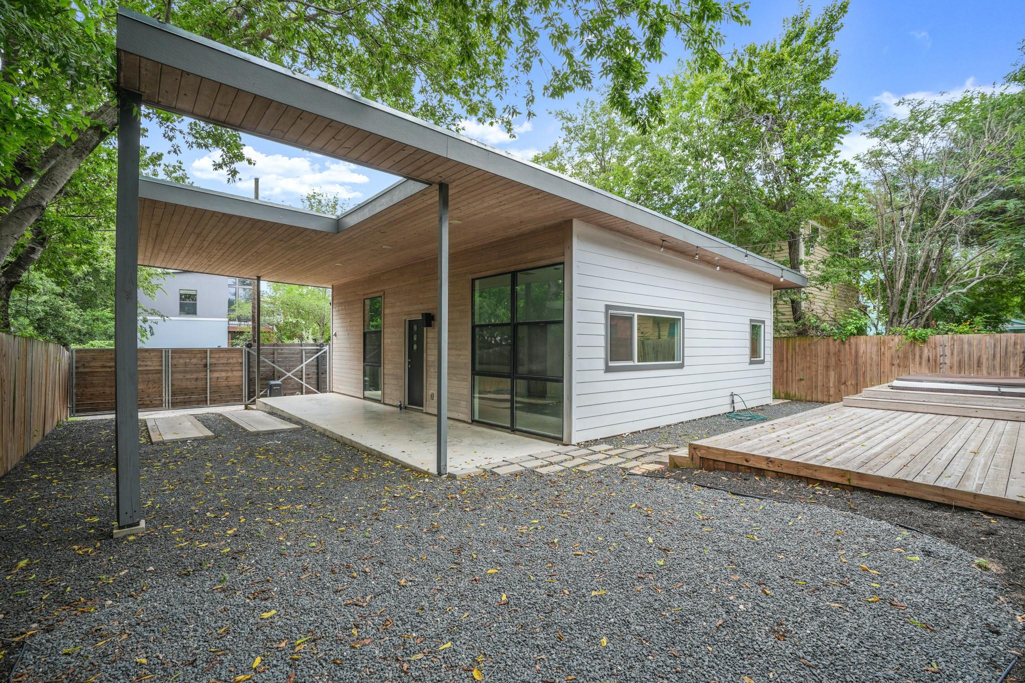 A modern guest house with a spacious gravel yard 