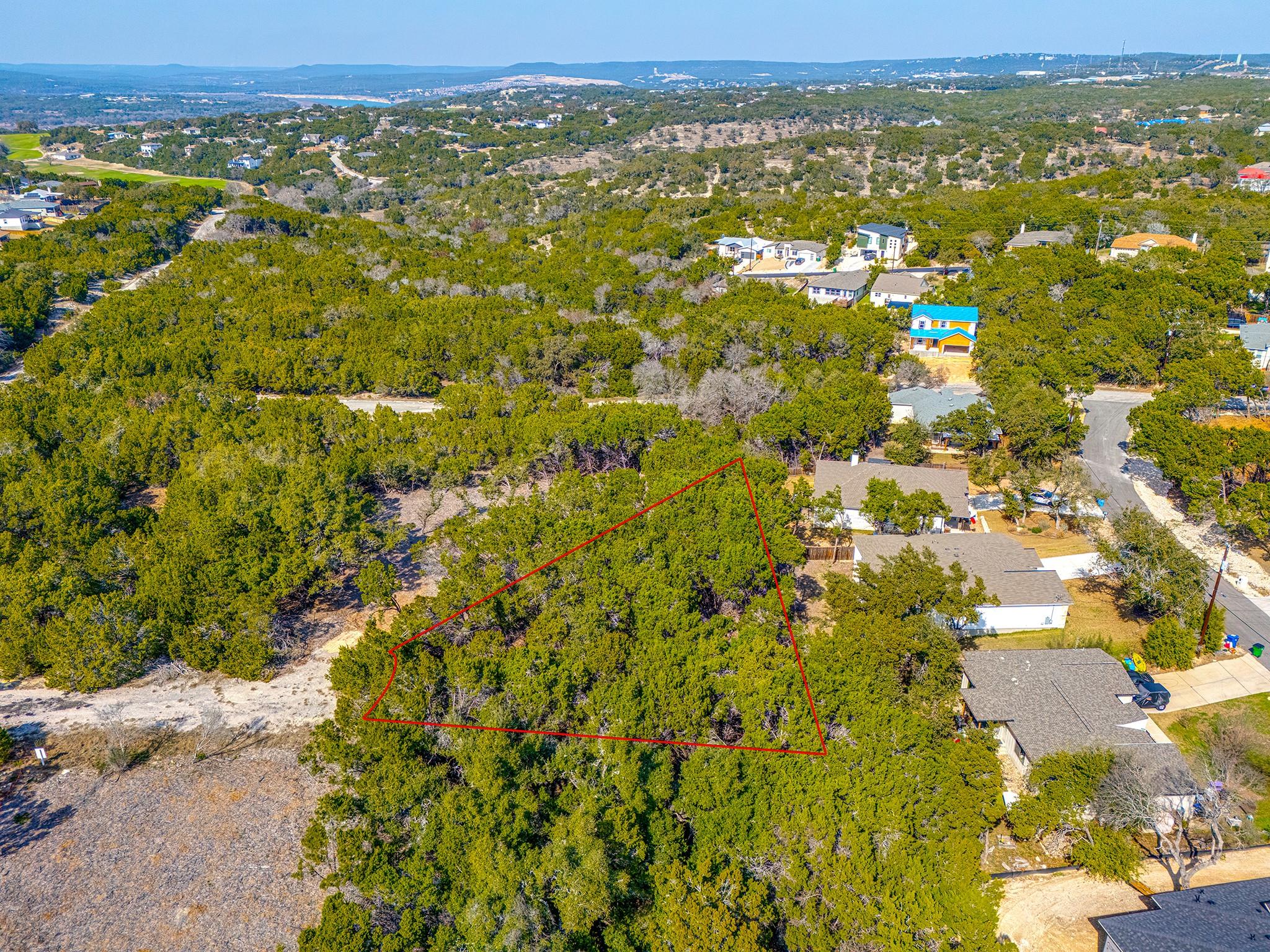 A verdant, buildable lot awaits amidst a serene, 