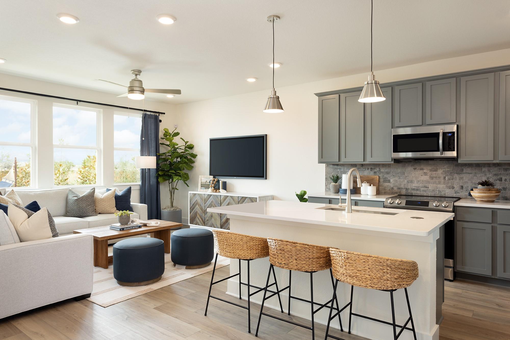 Open-concept living area featuring wood-finish fl