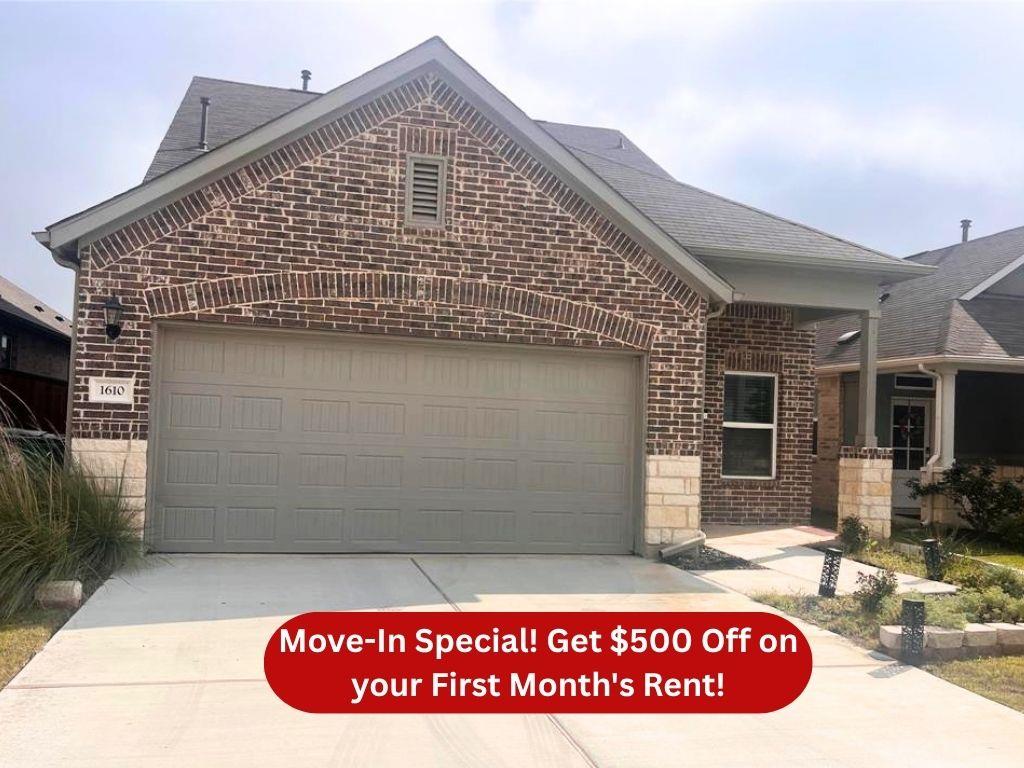 A classic brick exterior with an attached garage 