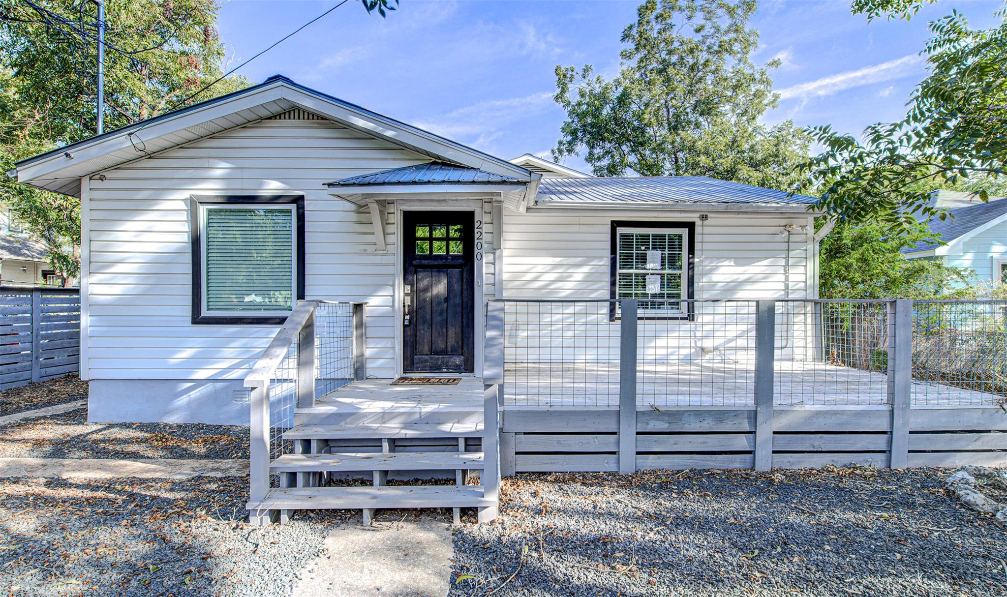 An inviting front deck leads directly to the entr