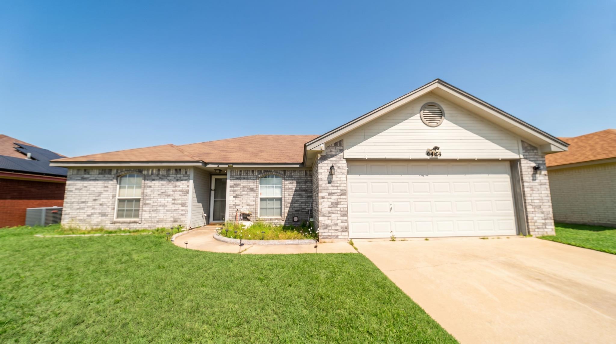 A well-maintained lawn welcomes you to this singl