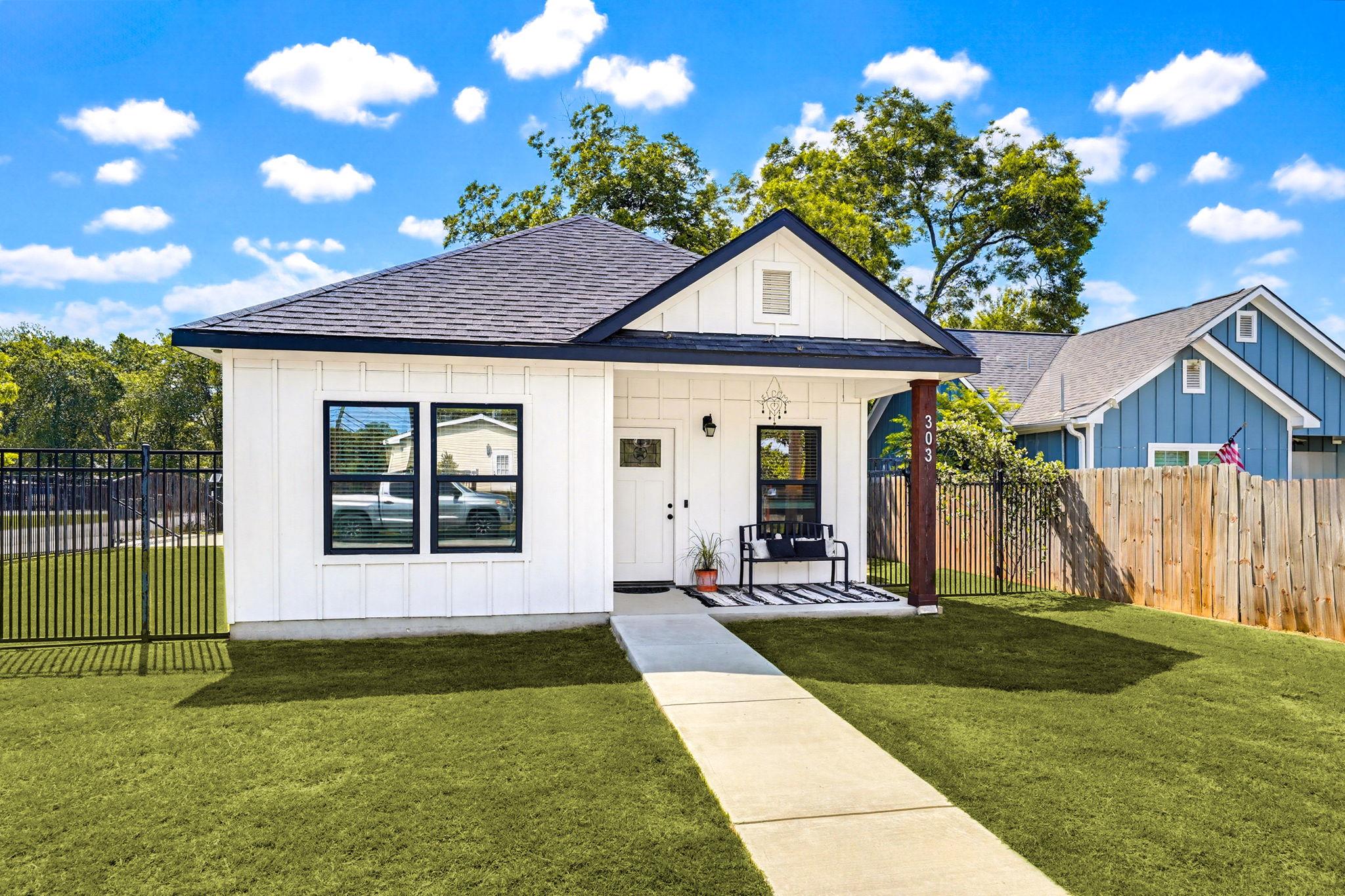 Modern farmhouse style residence featuring white 