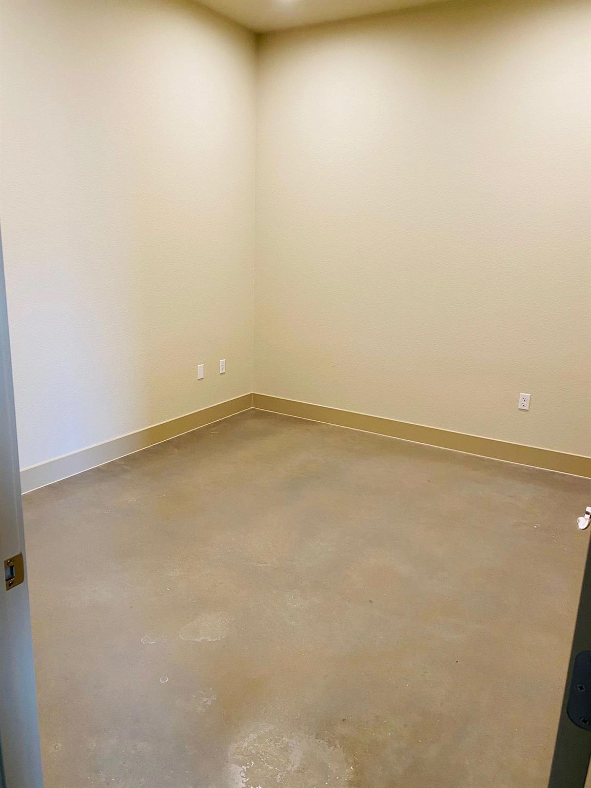 Neutral tone wall finish with baseboard trim and 