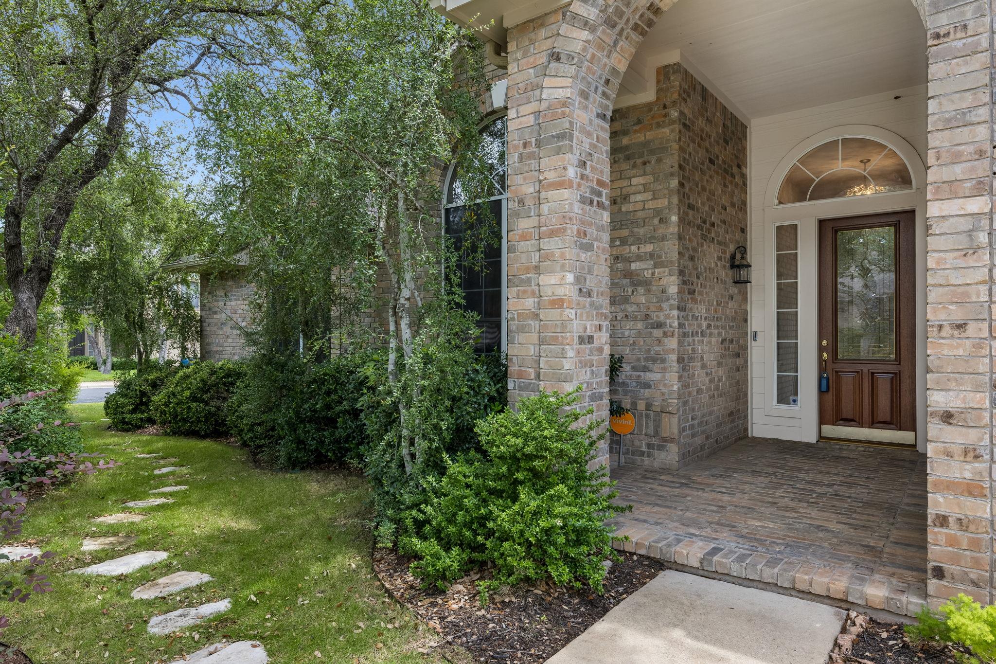 A welcoming brick facade with an arched entryway 