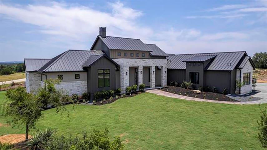 Modern farmhouse-style exterior featuring a metal