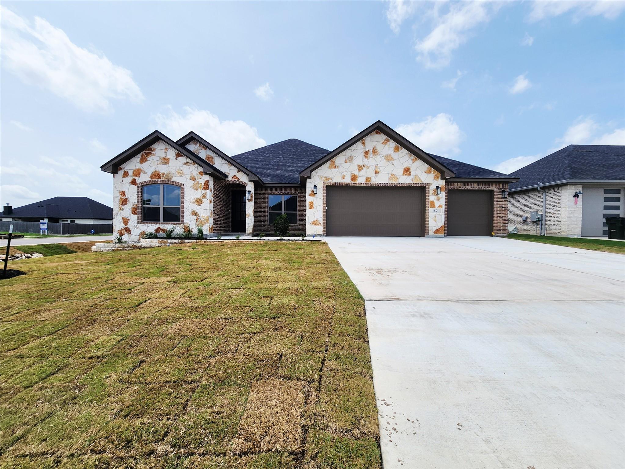 A newly built residence showcasing a blend of bri