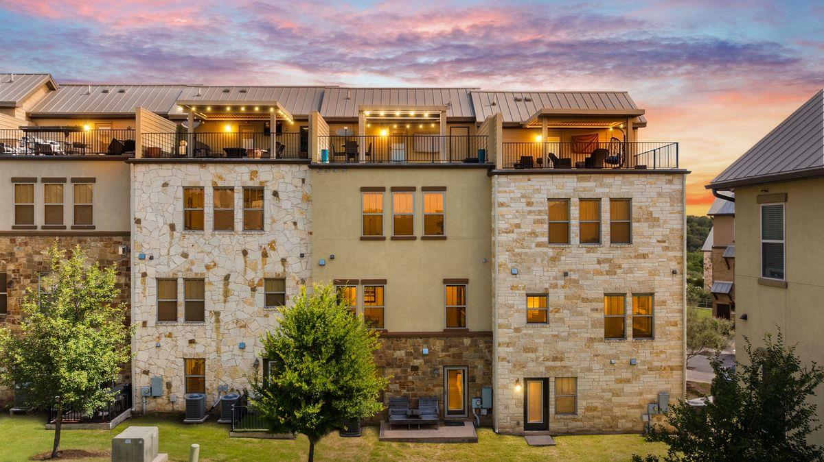 Terraced rooftop patios and stone accents define 