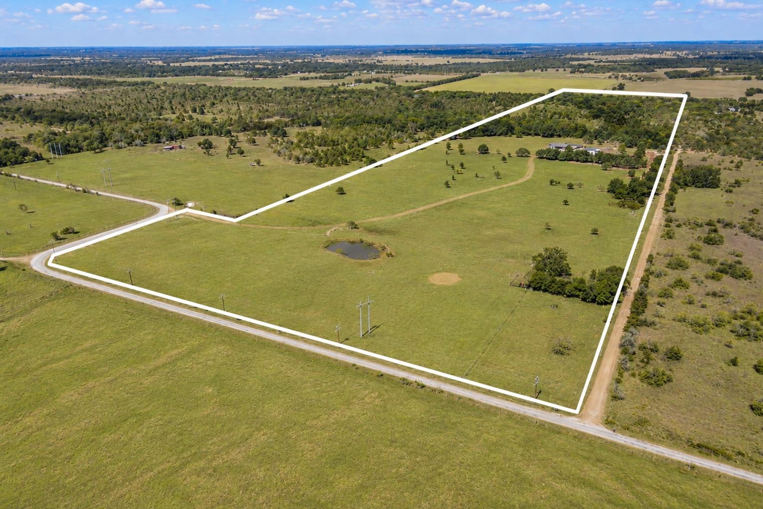 Expansive property featuring a mix of open grassy