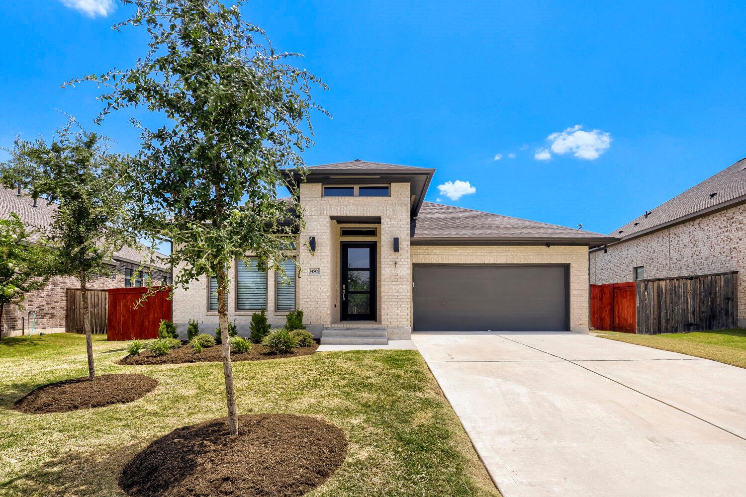 A cream brick facade welcomes you to this residen