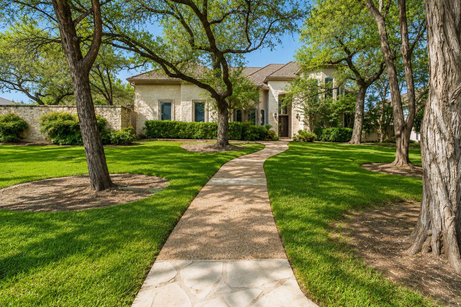 Stately stone exterior residence with a gently wi