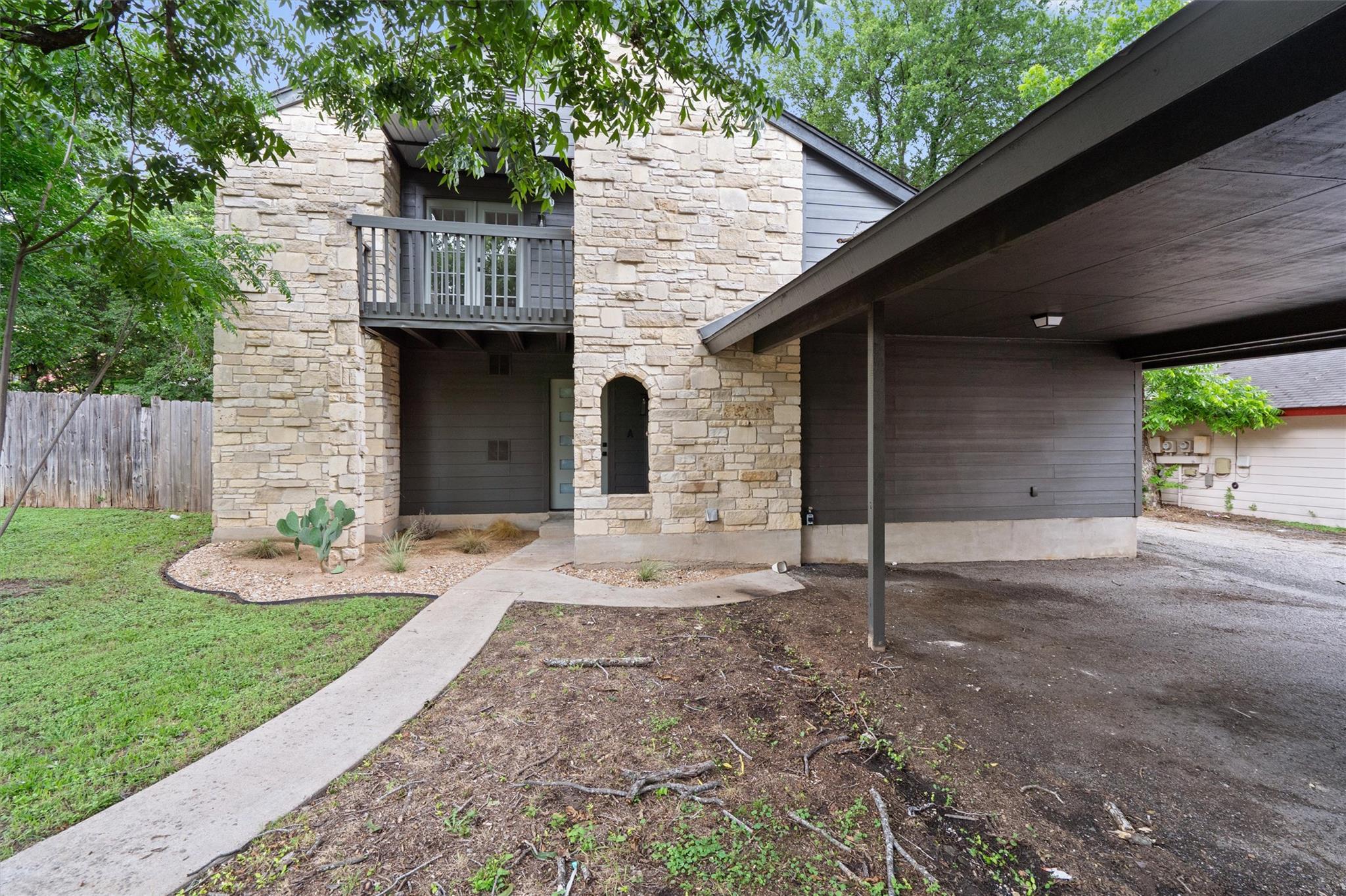 A striking exterior featuring stacked stone and r